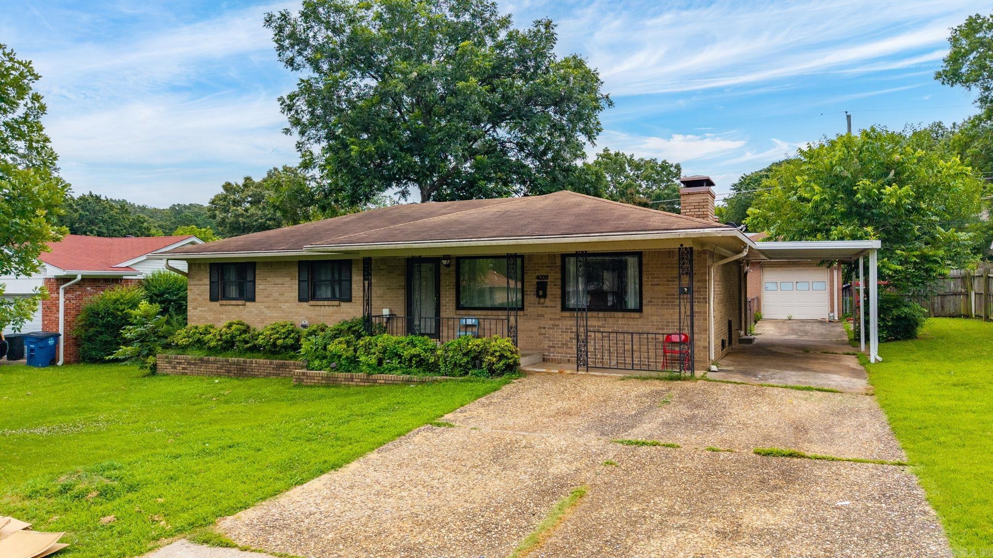 Welcome home to this charming 3-bedroom, 2-bath residence nestled on a quiet street in an established neighborhood. Built in 1967, this home offers comfortable living spaces and plenty of flexibility to fit your lifestyle. The spacious living room provides the perfect gathering space, while the eat-in kitchen offers room for casual dining and everyday living.  Just off the kitchen, you'll find a heated and cooled sunroom currently being used as a fourth bedroom, making it an ideal space for guests, a home office, playroom, or hobby room. Outside, enjoy the large backyard complete with a gazebo—perfect for relaxing, entertaining, or enjoying the outdoors.  Additional features include both a carport and a one-car garage. The garage offers endless possibilities and could easily serve as a workshop, man cave, she shed, workout space, or additional storage. With its versatile floor plan, generous outdoor space, and peaceful location, this home is ready for its next owner to make it their own.  Sellers are offering a $5,000 update allowance with acceptable offer.