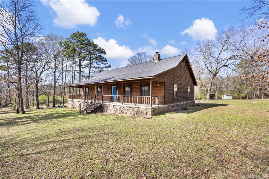 Tranquil paradise is what you will find here in this 3+ BDR, 2.5 BA custom home on Linker Mt. Features include a vaulted ceiling with a custom-built native rock fireplace and warm, wood-accented walls & ceilings.  Open kitchen dining w/ custom fridge/freezer. The bedrooms are oversized, with the primary suite featuring a W/P tub & large walk-in closet.  Loft-style upstairs, complete with a recreation area, a pool table, and a possible 4th bedroom. Oversized garage w/ plenty of room to work or move around in.  Sitting on 15 acres of beautiful natural Arkansas landscape, with a distant view of the mountains from the spacious front porch that extends across the house, is a perfect place to sip coffee or a glass of cold tea.  Less than 10 minutes from dining, shopping, and more.