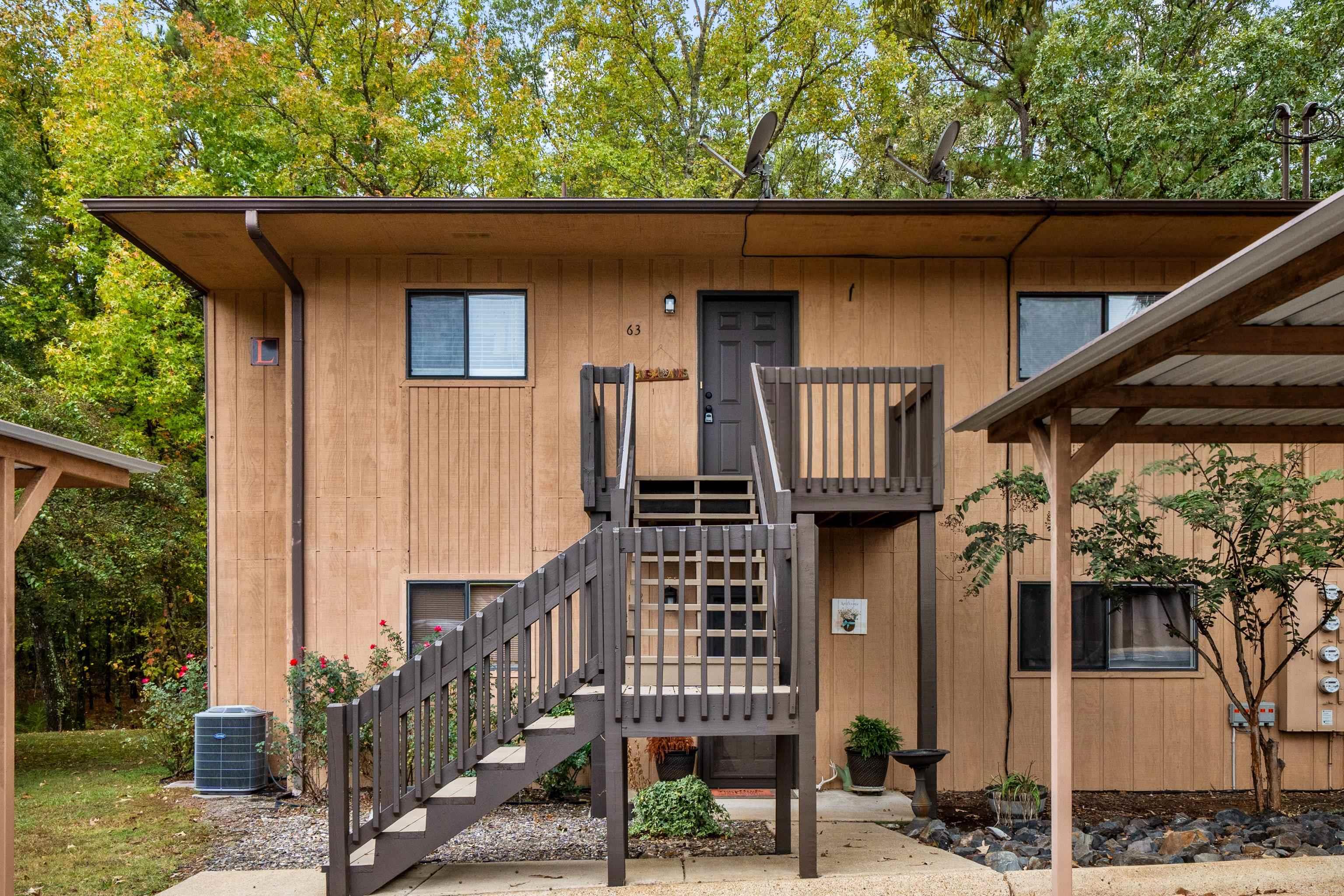 Charming 2-Bed, 2-Bath Condo in the Heart of Hot Springs! Welcome to this inviting 2-bedroom, 2-bathroom condo conveniently located in the heart of Hot Springs. Enjoy peaceful wooded views from your private balcony, perfect for relaxing or entertaining. The spacious living area features an electric fireplace, Beautiful patio door that fills the space with natural light. The primary suite offers two walk-in closets and a private en suite bath for added comfort. Community amenities include a sparkling pool and scenic walking trail.  Located near shopping, dining, medical facilities, and entertainment, this condo offers the perfect blend of convenience and tranquility. Ideal for a full-time residence, weekend retreat, or investment property.
