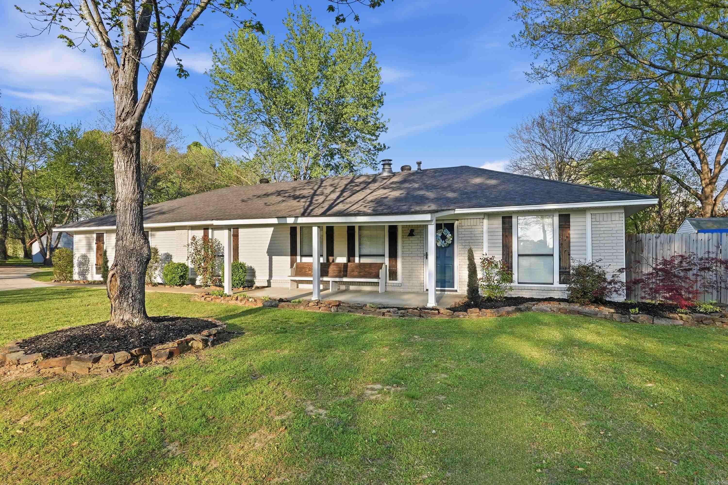 4 minutes from everything, not a better access to the interstate.  New paint, new roof in 2022 , new hot water heater 2022, new AC unit 2024.  New cabinets and countertops. Big walk in closet in the primary bedroom. Vaulted ceiling with beams. Marble floors and vinyl plank. New lighting and trim. Garage is heated and cooled but not counted in sq ft. Garage has a large closet.   other rooms were added from the garage to make sq ft bigger than tax records shows.  Kitchen has a pantry and a mud room off the garage that can be additional pantry, small home office.Split floor plan and a large fireplace.  Back yard has a storage building and Deck with fenced yard. Corner Lot side entry garage. New concrete drive.  Clean and ready for you to move in.