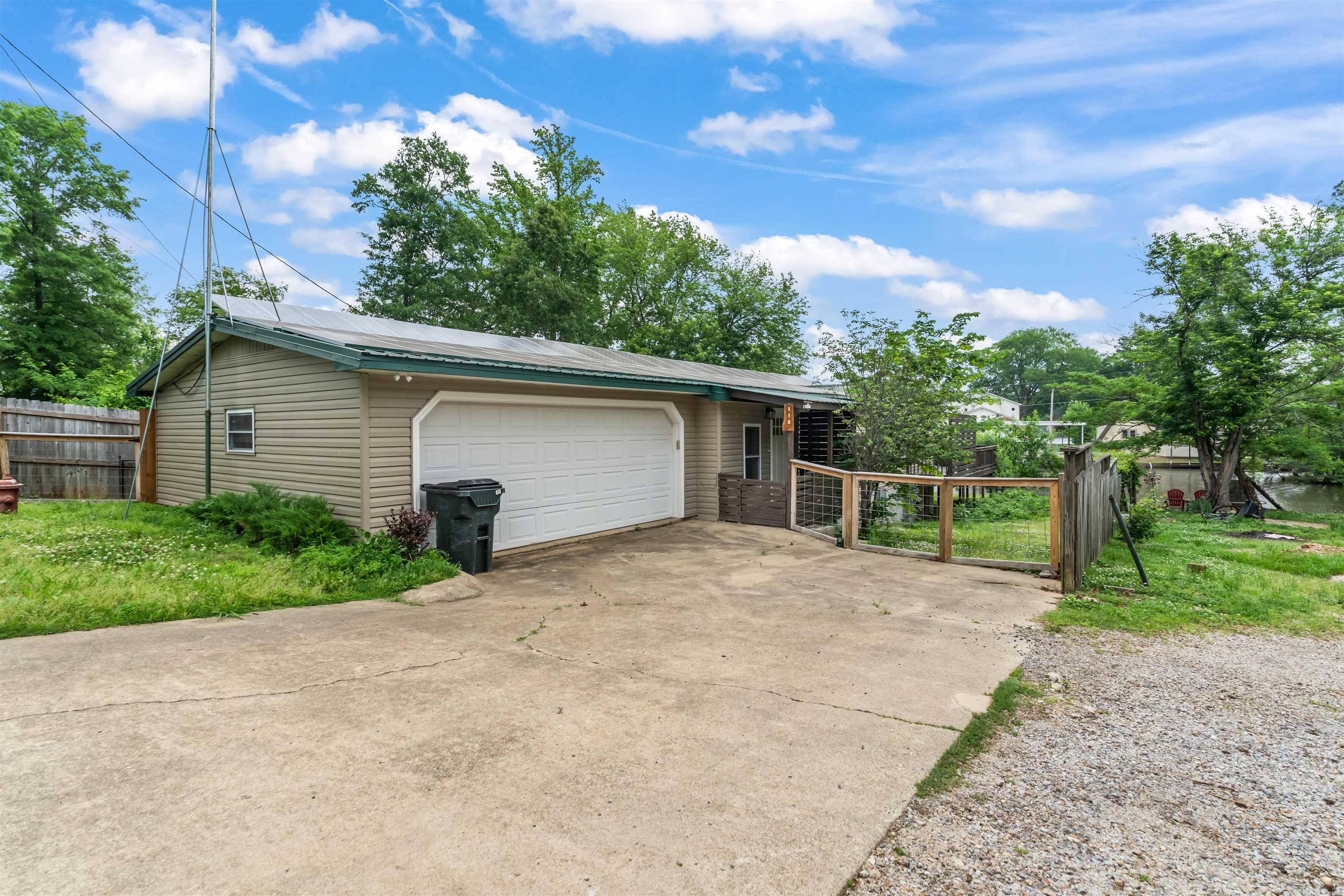 Welcome to your own slice of waterfront luxury on beautiful Lake Hamilton with direct access to the Ouachita River! This stunning, move-in ready property offers the perfect blend of relaxation, investment potential, and modern updates. Currently operating as a successful Airbnb, this home is ideal for short-term rental income or a private getaway. Inside, you’ll find a fully renovated interior featuring durable laminate flooring, updated tile bathrooms, and sleek new kitchen appliances—designed for both style and functionality. Step outside to enjoy a semi-covered, screened-in deck that leads you straight down to the water.  Quaker Lane currently has 4 busy Air BnB's and is surrounded by long term tenants! Great neighborhood-well lit at night. Permitted dock ready, giving you the opportunity to create your own private lake access and maximize both lifestyle and investment value. Additional upgrades include Energy-efficient solar panels and a recently updated crawlspace with cinder block support and improved ventilation. Waterfront properties like this are a rare find—don’t miss your chance to own a turnkey investment or personal retreat in a prime location! Sellers Are Motivated!
