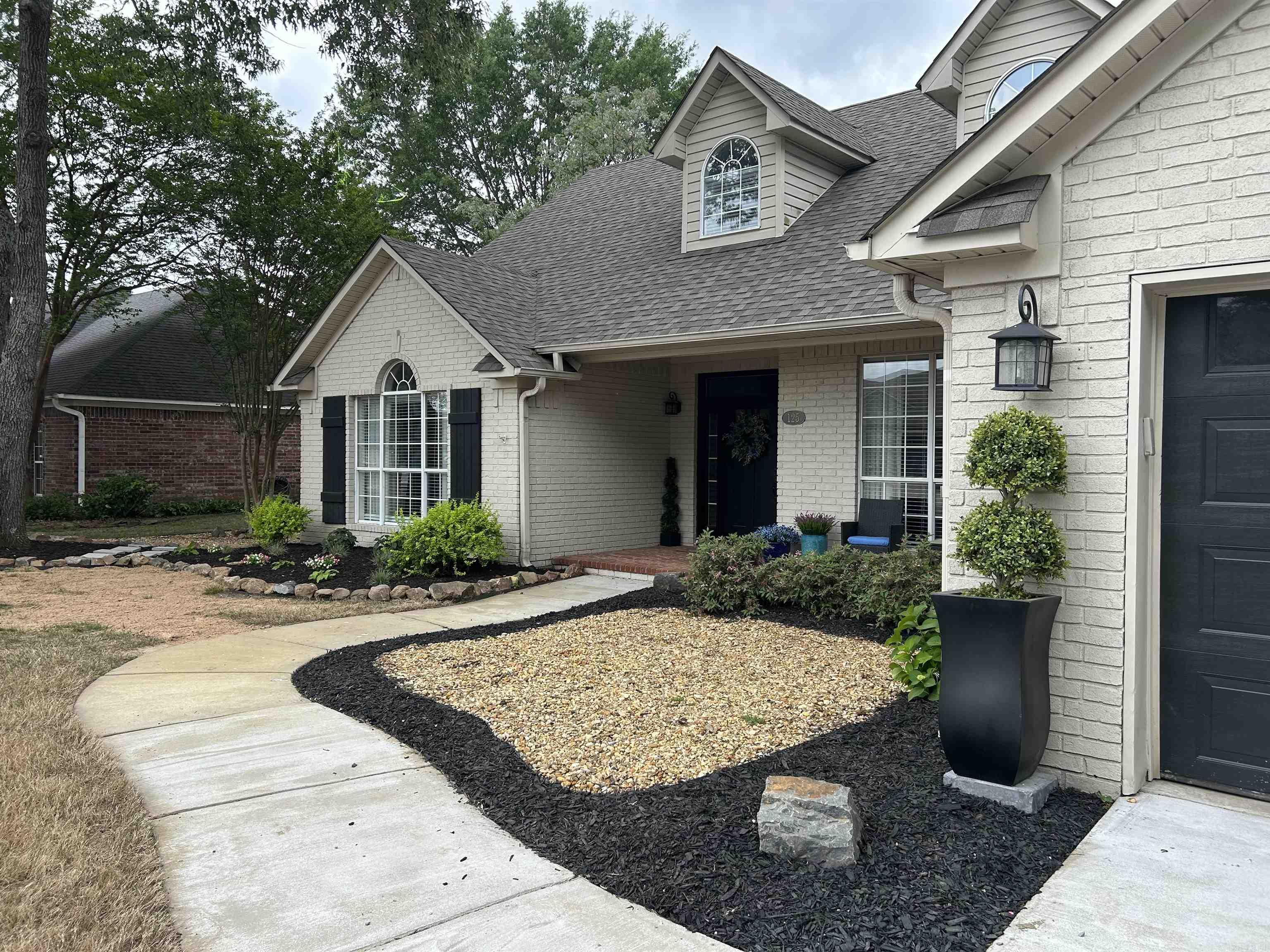 Space for everyone — FIVE bedrooms and THREE full baths in West Conway’s Dallas Subdivision. This 5BR/3BA home offers a functional multi-level layout ideal for families. The upper level 2bed/full bath and a sitting area provides a private space perfect for in-laws, guests, or teens suite. The main level features a split-bedroom plan with the Primary Suite positioned apart from two secondary bedrooms.  The kitchen is finished with granite countertops and shiplap accents, opening to a breakfast area. Refrigerator conveys. A separate formal dining room offers additional gathering space.  Step outside to your private backyard retreat featuring a beautiful in-ground pool. The fenced yard includes two newly installed gates, a custom matching trash enclosure, two additional poured concrete pads for extended outdoor use, and a  deck with added structural covering.  Updates include architectural shingle roof (2022), interior paint (2021–2023), carpet (2021), and updated light fixtures throughout. HVAC has been regularly serviced and maintained. Located on a quiet cul-de-sac right off walking trails walking distance to shopping.