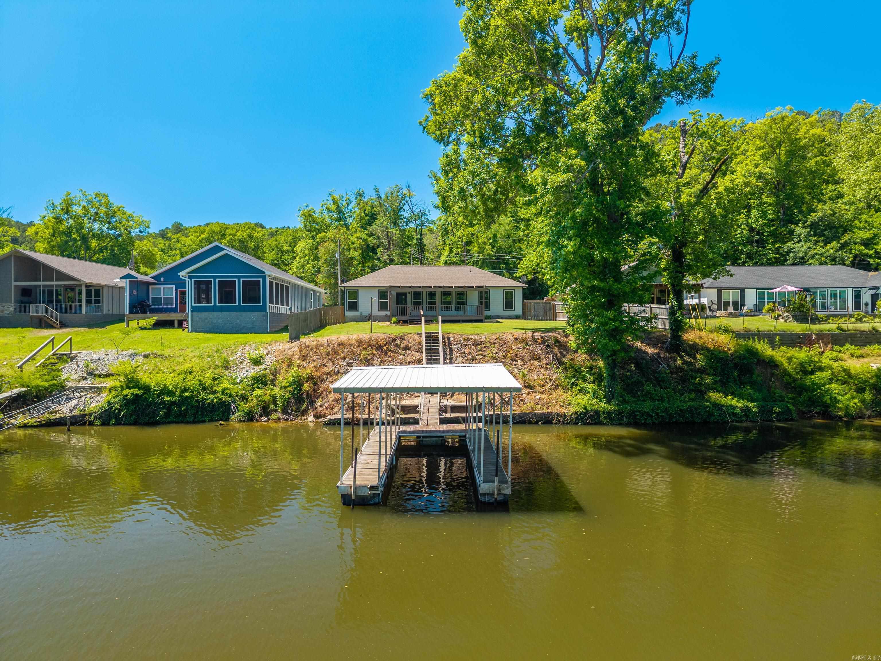 Beautiful waterfront home on Lake Catherine offering the perfect blend of comfort, convenience, and investment potential! Built in 2020, this well-maintained 3-bedroom, 2-bath home features 1,512 sq ft of modern living space with an open floor plan, spacious kitchen, and relaxing lake views. Enjoy deep water access year-round along with your own covered boat slip ideal for boating, fishing, and lake living. Conveniently located less than 10 minutes from shopping, dining, entertainment, and all that Hot Springs has to offer. Whether you’re looking for a full-time residence, vacation getaway, or income-producing property, this home has excellent potential as a short-term rental. Don’t miss this rare opportunity to own a move-in ready waterfront property on beautiful Lake Catherine!