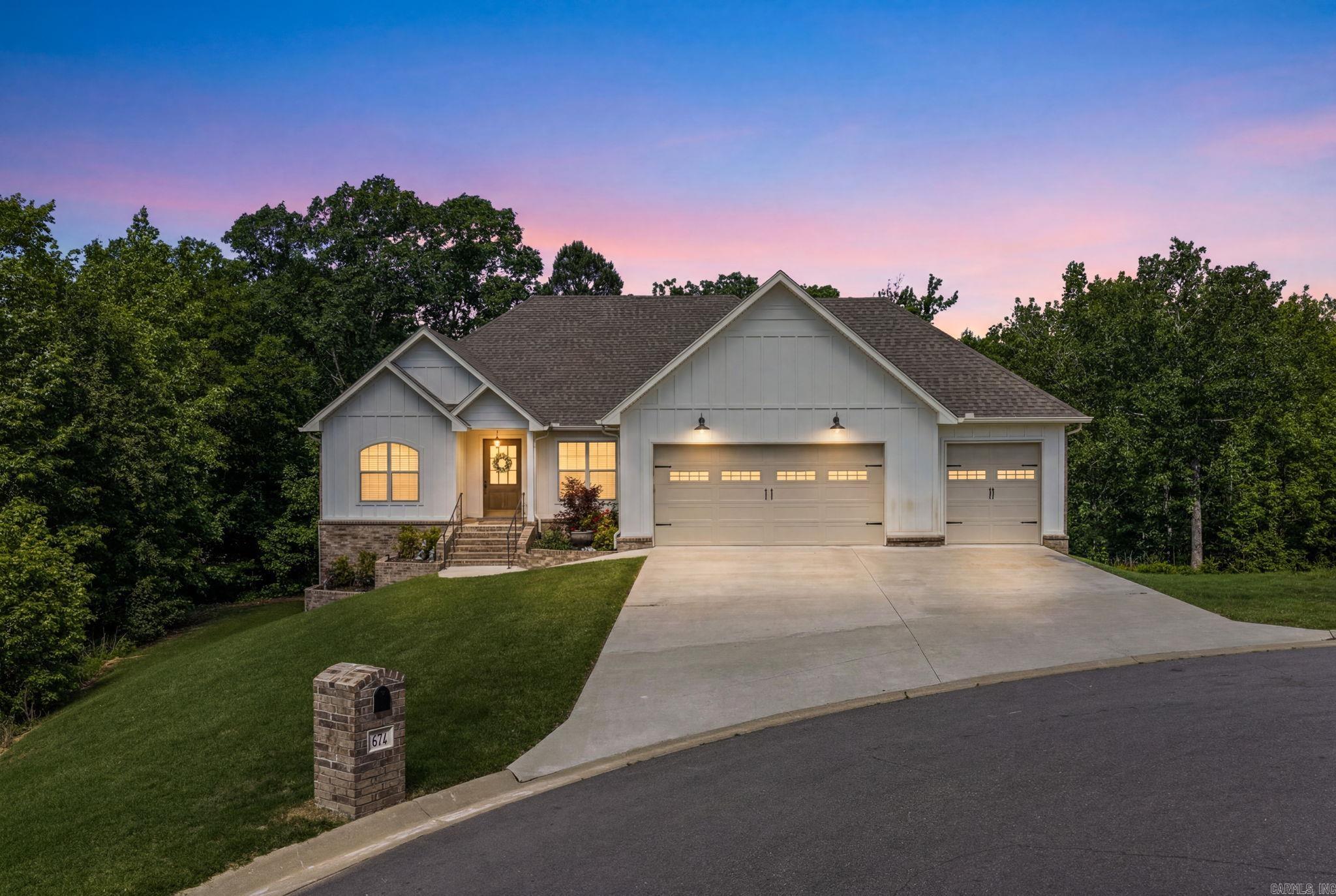 This is absolutely a dream home in a great subdivision with new homes. Located down a cul-de-sac with trees for privacy and a country feel. This stunning brick home has 3 bdrs. 2 bath on main level with 2 Bdrs. 1 bath on second level plus has a bonus level that has a large basement with outside entry that is a shop or could be a man cave or finish it out for more room.  Gorgeous open kitchen, and formal living room with a cozy fireplace. It has a separate room that can be used for office or a dining area. The large master bedroom has a sitting area and a huge walk-in closet that connects to the large laundry room/mud room that goes to the garage, so convenient. The second level with the 2 bdr. 1 bath is just as great that opens up to a deck that you can enjoy the view. Lots of storage and closets and lots of potential for growth. 3 Car garage. Home is very Energy efficient with a tankless water heater, radiant barrier roof and gas filled vinyl windows. Click on the video for a view of this beautiful home and then make your appointment to see this dream home!!!!