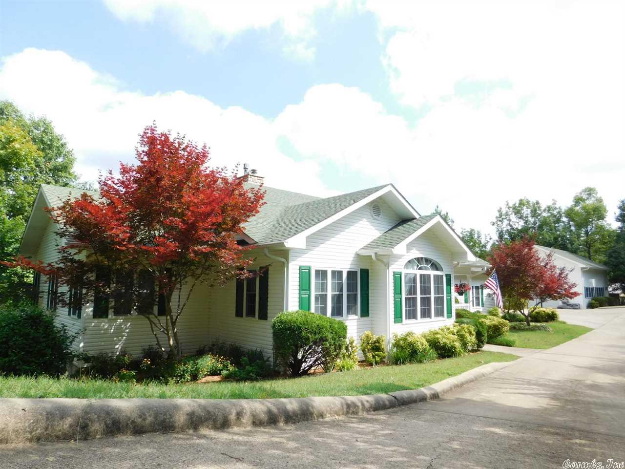 Show Stopper Lakefront...Look no more when you view this fabulous 4 br, 3.5 bath with 7 lots, RV storage (with hookups for 30-50 or 110 & dump station), 2 car garage, shop, mostly finished walkout basement, private dock, multiple decks, screened in porch, gazebo, water-slide, water falls, tasteful landscaping, extra parking, fantastic views, flowers & oak trees galore, gas log fireplace, graced with name brands like Jacuzzi, Jenn-Air & home protection plan by seller. $375,000