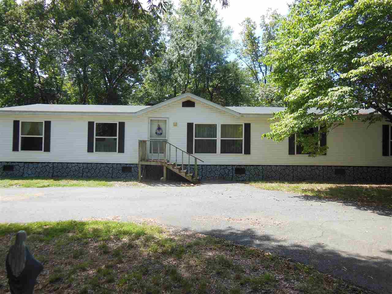 Beautiful level peaceful setting with large manufactured home. 3 stall 24x36 shop and a 16x20 out building will never let you run out of storage. Oh and I didn't mention the auto start full service generator approx. 3 years old that comes with property. Wait there's more! Hot water tank replaced 9 months ago, roof replaced approx. 5 years ago, AC pump replaced 3 years ago, furnace replaced less than a year ago. There is a 1 year home warranty with 2-10 that seller is providing.