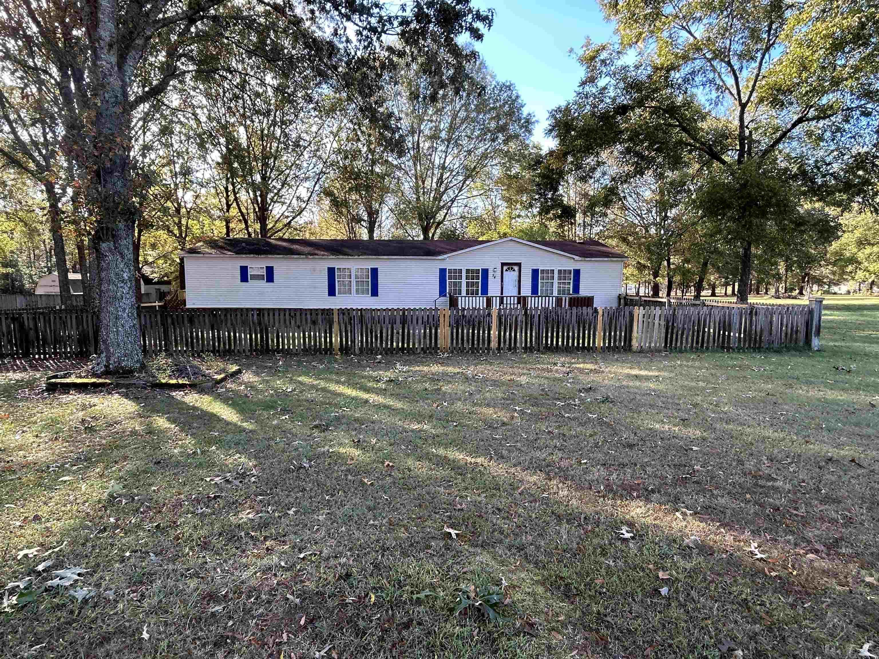 Manufactured home that is on a 1.35 acre lot. Large kitchen with plenty of countertop space. Three nice size bedrooms plenty of closet space. Two living areas. Nice deck out front to set out on or sit out back in your covered screened porch. Also a large storage shed conveys with the home. AC condenser and heat pump are 4 years old. **SOLD AS IS**