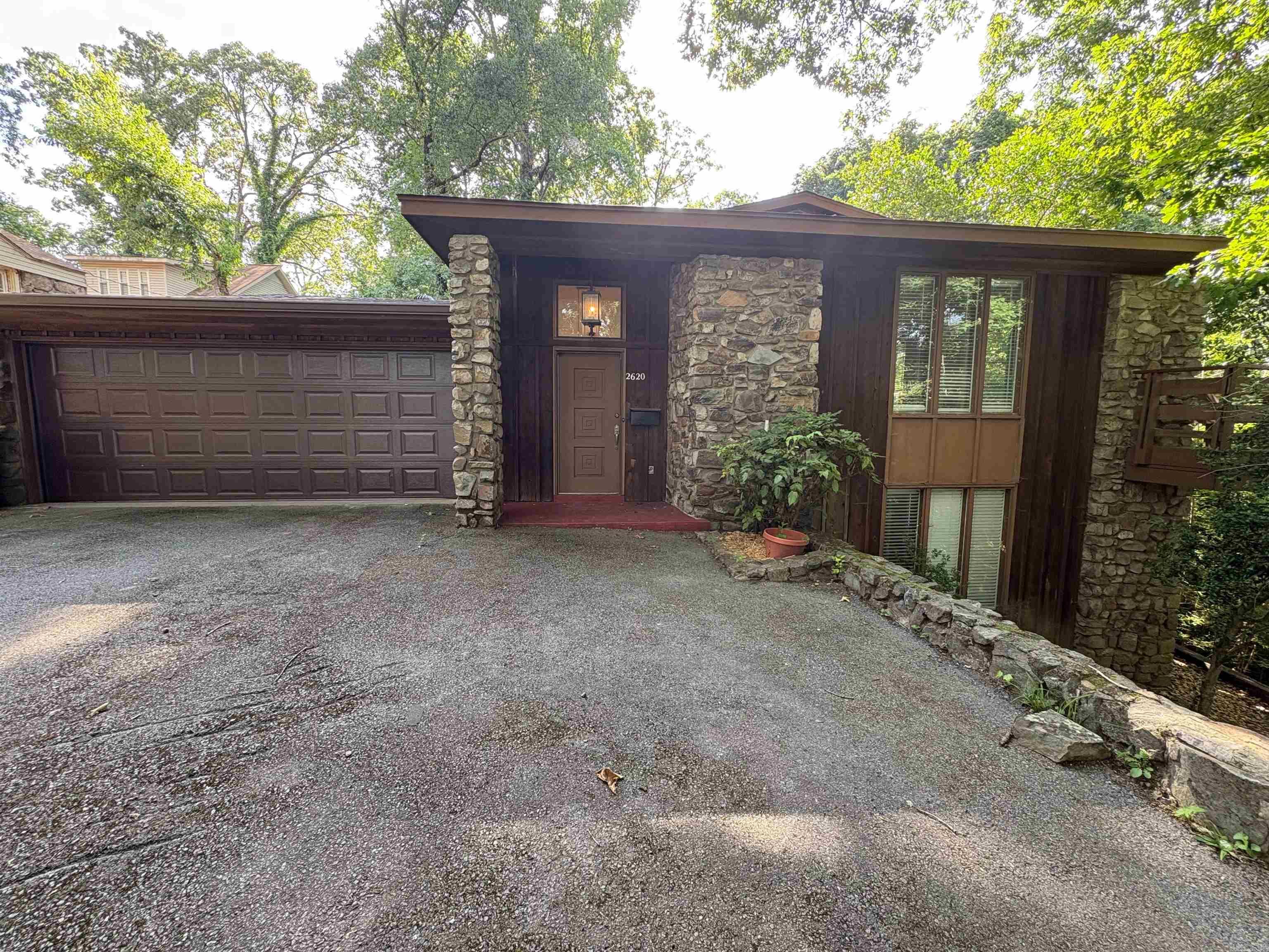 Beautiful mid-century style home located in the Heights. 3-bedroom, 3-bathroom home is situated on a quiet, private lot with a serene, wooded setting that feels incredibly cozy. It features a spacious living room with large windows, a two-car garage, and a large deck perfect for family gatherings. Close proximity to great schools, hospitals, shopping, and fine dining.