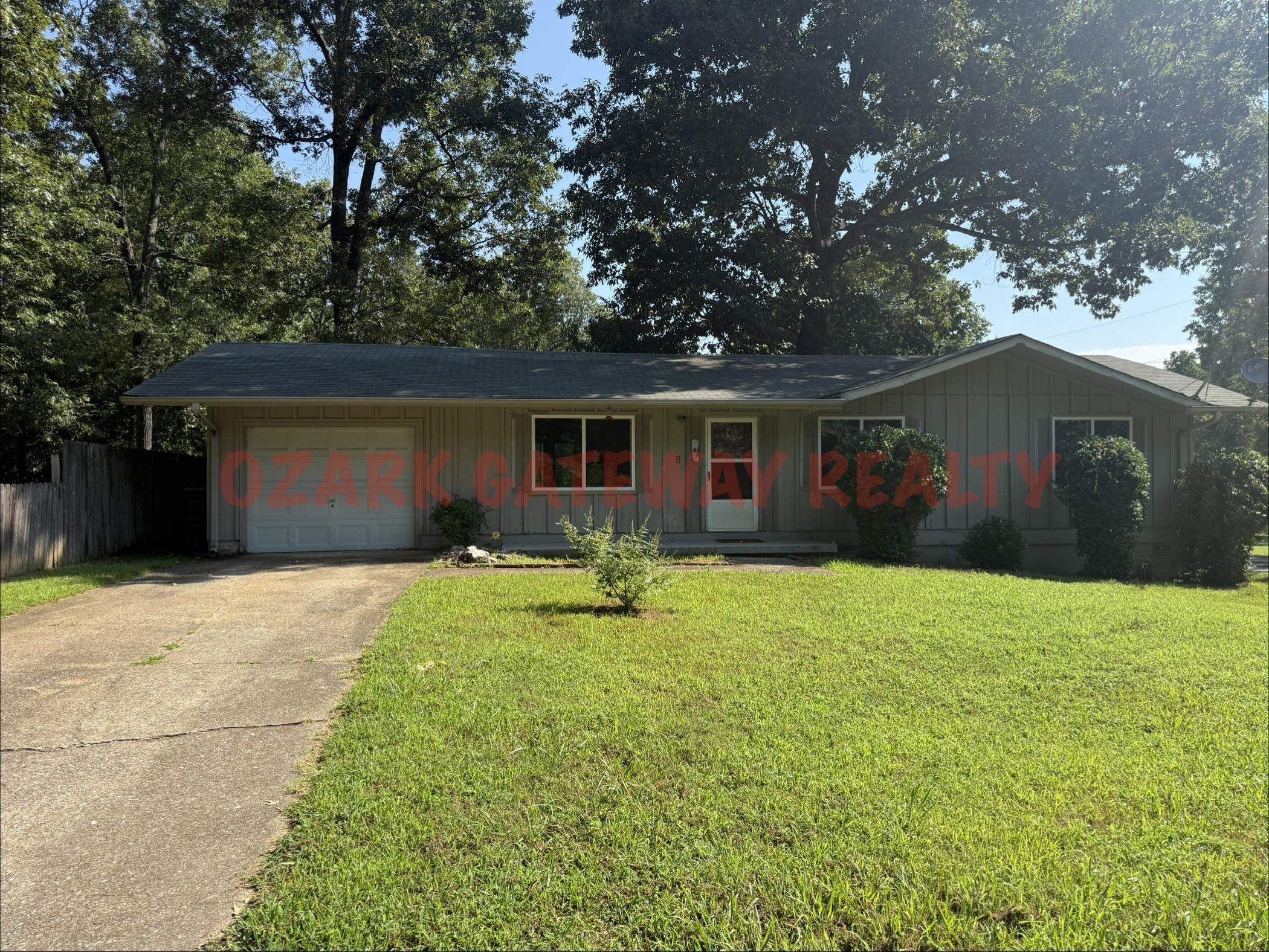 Avail Now...this 3 bedroom 1.5 bath home sets on a large corner lot with a fenced back yard. New appliances: side-by-side refrigerator & elec stove & vent hood. Home is all electric. The bathroom was remodeled with a nice walk-in shower. The garage could be converted into a 4th bedroom.  It has a window ac. Central HVAC. New Laminate flooring through-out. Washer/Dryer hookups. Also included is a large workshop with a 1/2 bath inside the fenced in back yard. Very versatile property. Can only be rented month to month due to future plans to list for sale so tenant will have the first opportunity to purchase. $25 will be added to the rent to cover pest control services. Each adult 18+ is required to complete an application.
