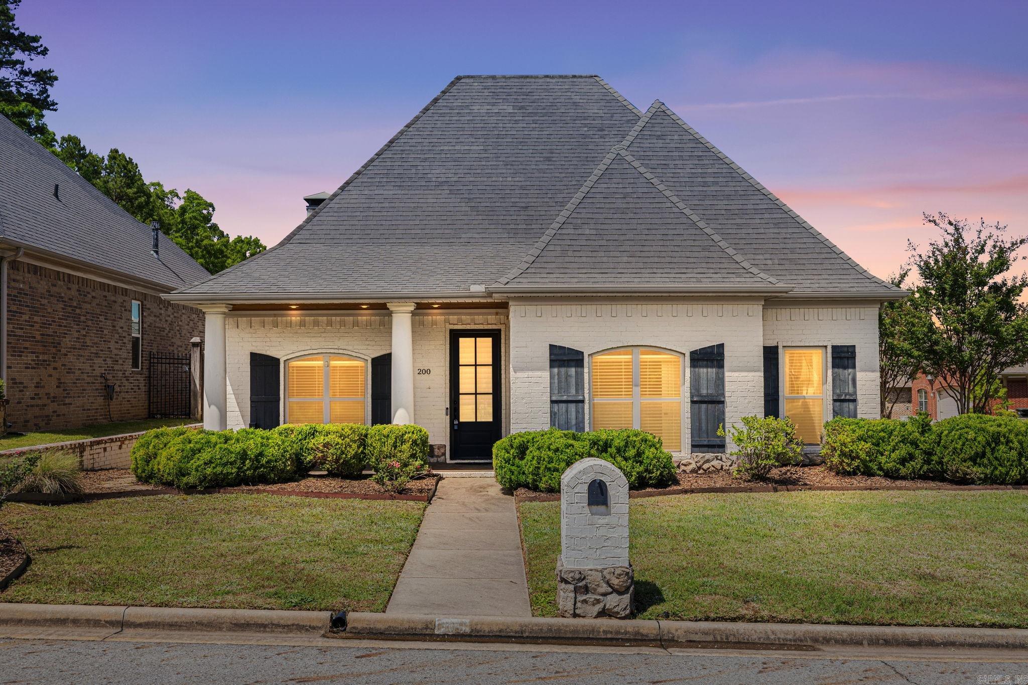 Welcome to 200 Garden Valley Loop! This beautifully maintained custom-built home offers an open and functional layout in a convenient location within walking distance to Don Roberts Elementary School. The kitchen opens seamlessly to the living and dining areas, creating a great flow for everyday living and entertaining. Features include custom cabinetry, granite countertops, stainless steel appliances, ample storage, and generous counter space. The spacious living room offers a cozy fireplace and plenty of room to gather. The primary suite features a walk-in closet, soaking tub, and spacious bathroom layout designed for comfort. Enjoy outdoor living with both a covered back patio and screened-in porch, offering the perfect place to relax, entertain, or enjoy the outdoors year-round. Conveniently located near schools, shopping, dining, and more, this home offers comfort, function, and quality craftsmanship in one package. Agents please see remarks.