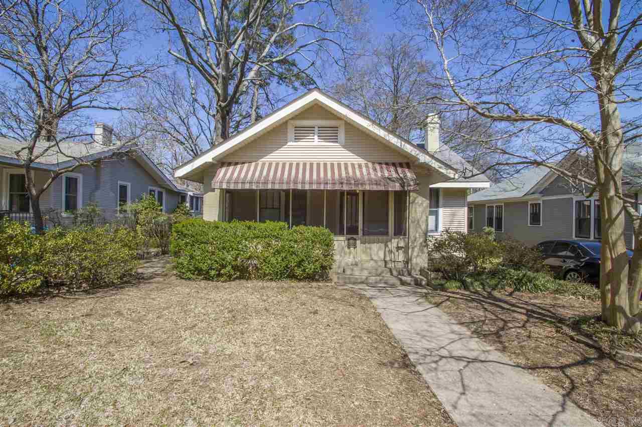 Adorable Heights Craftsman Cottage with screened in porch! Awesome location you can walk to Forest Park!  Lots of great space includes living room, dining room, eat-in kitchen, office, laundry room plus 4 bedrooms. Living room has fireplace.  Lots of character and charm! Fenced back yard with deck plus 2 parking pads off the alley in the back. Needs updating but you can't beat the location! See agent remarks-