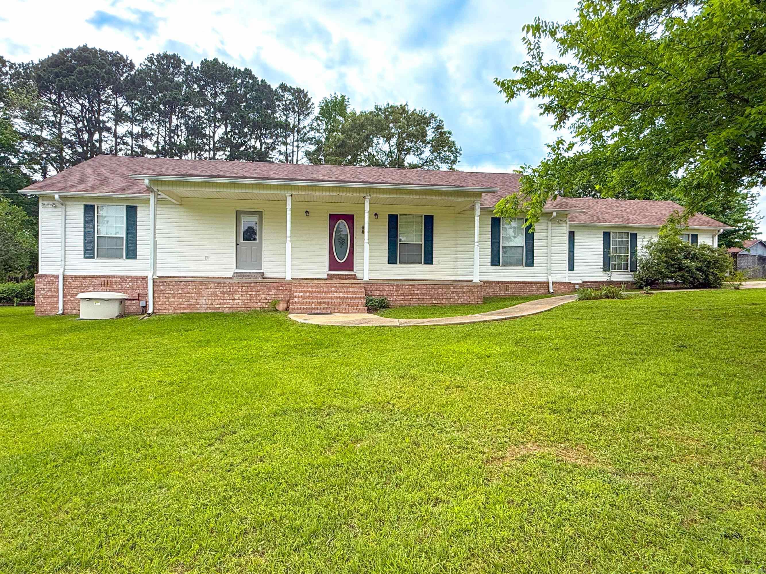 Live and farm on this beautiful 25.41 acres.  This home is spacious with 3 bedrooms and 2.5 baths.  You will find solid wood cabinets with pull outs in the kitchen with plenty of storage.  Large open living room great for entertaining.  The outdoor space is a dream.  Sit on the covered front porch for a peaceful look into the pasture.  Raining - no problem, sit on the back screend in porch for outdoor retreat.  Pond, pastures, out buildings and more.  Never go without power with the whole home generator.  No fear of storms with the tornado shelter in the oversized garage.  ...New Roof in 2025...So much potential. Interior pics coming soon**Agents see remarks***