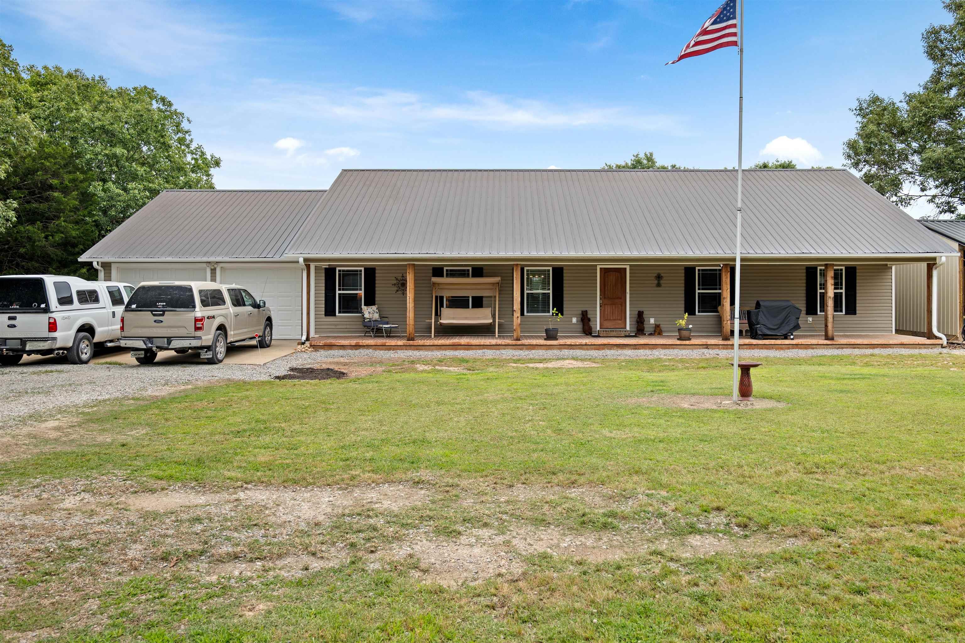 Escape to the peace and privacy of country living with this move-in ready home situated on 11.54+/- beautiful acres in Batesville. Tucked away in a secluded setting, this property offers the perfect blend of comfort, space, and tranquility. From the moment you pull in, you’ll fall in love with the oversized front porch stretching across the entire front of the home — the perfect place to enjoy quiet mornings, evening sunsets, and the beauty of nature all around you. Inside, the home features spacious rooms, a comfortable layout, and an abundance of storage throughout. The large screened-in back porch creates another relaxing space to unwind and enjoy the peaceful surroundings year-round. The finished garage showcases beautiful wood slate accents, adding warmth and character while offering excellent workspace or storage options. This property is truly set up for easy living with a backup Generac generator already in place for added peace of mind. Whether you’re looking for a private retreat, hobby farm potential, or simply room to breathe, this property delivers the country lifestyle so many dream about while still being conveniently located near Batesville.