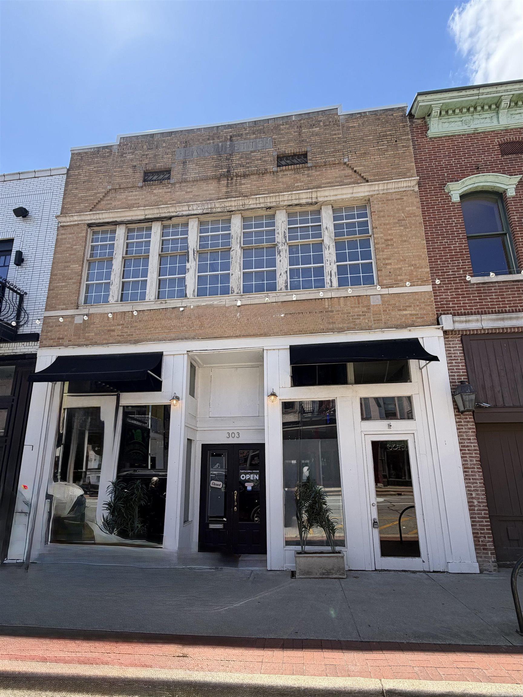 Opportunity meets character in the heart of downtown Jonesboro. This historic mixed-use property at 303 South Main Street offers endless potential with a fully operating restaurant space on the main level and an expansive upstairs ready for redevelopment. The upper floor is a true blank canvas ideal for office suites, creative studio space, upscale loft apartments, or a live/work concept. Originally designed for office use, the layout and location make it perfect for an investor, developer, or entrepreneur looking to bring new life to one of downtown's most recognizable spaces. Positioned in a high-visibility area surrounded by local businesses, dining, and ongoing downtown growth, this property offers flexibility, charm, and incredible upside potential in one of Jonesboro's most desirable commercial corridors.