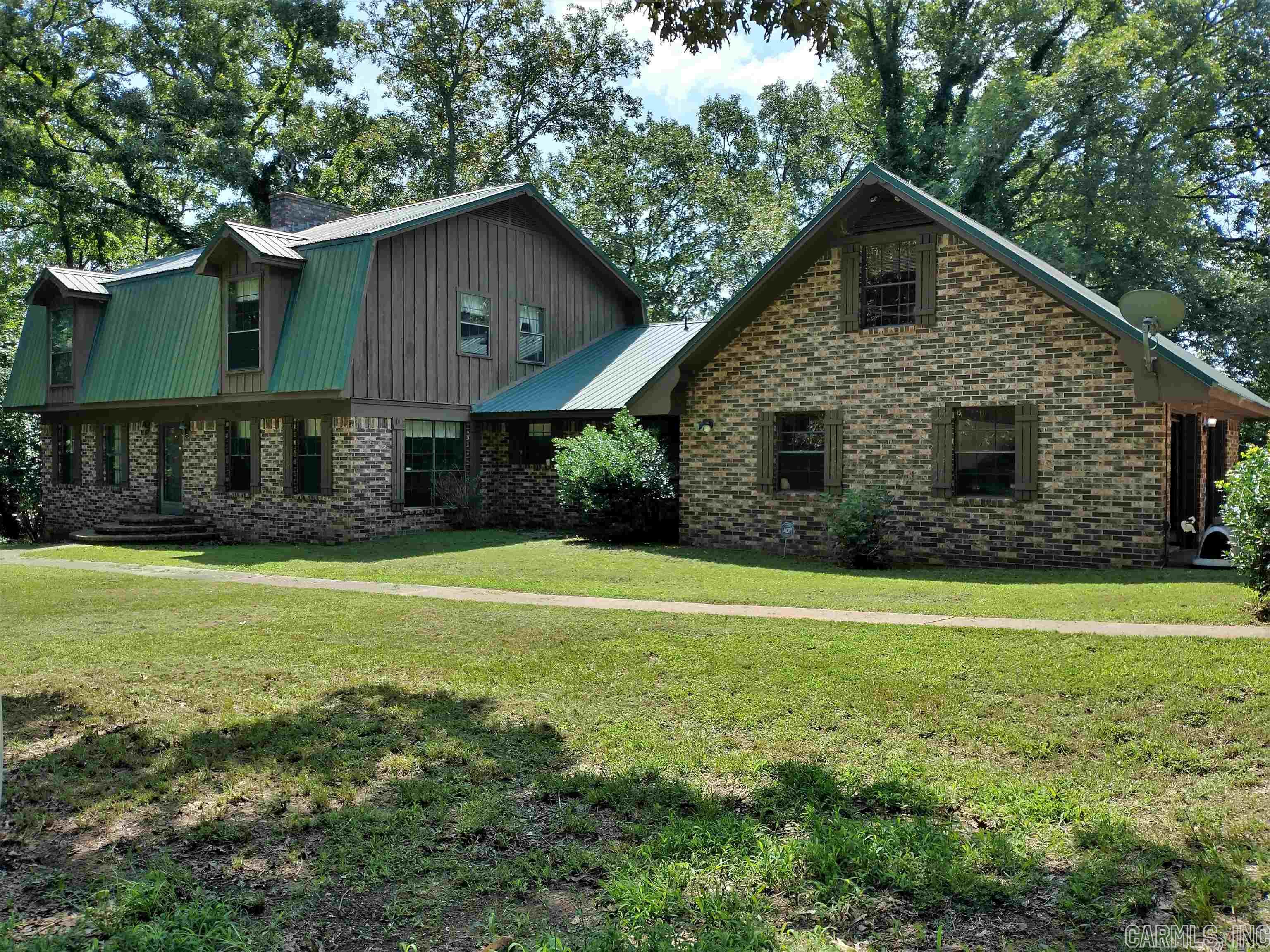 Beautiful Home On The Scenic Arkansas River In Clarksville.  This Over 2700 sq. ft. Home Borders the River.  The Very Well Constructed Home features 4 Bedrooms, 2.5 Bath, A Formal Dining Room, Fireplace In the Living Room, as well as, downstairs in the basement. You Can Enjoy The Outdoors With Your Choice of 2 Large Decks, One on the Basement Level and One on the Main Level. There's a large 2 car attached garage, but, you also have a 2,000 Sq. Ft., well Insulated Shop Building With Electricity for more parking and storage. Then, if that's not enough to peak your interest, it comes with 31.44 Acres m/l, That Has a Pole Barn & 2 Ponds. All Data Is Taken From The County Courthouse Records.  Don't let this One Owner Home, on the River, Slip Through You Hands, Make Your Appointment to See It Today!