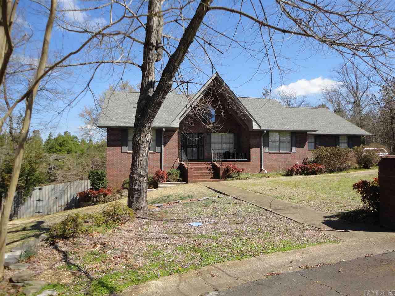 Looking for more living space?  Huge great room, master bedroom w/sitting area, formal dining room, kitchen w/lots of cabinets; basement w/bedroom, den and one bath, workshop.  Detached, covered out door living area, separate garage for your mower & yard equipment.  New roof, a/c units are two years old.  Agent remarks.