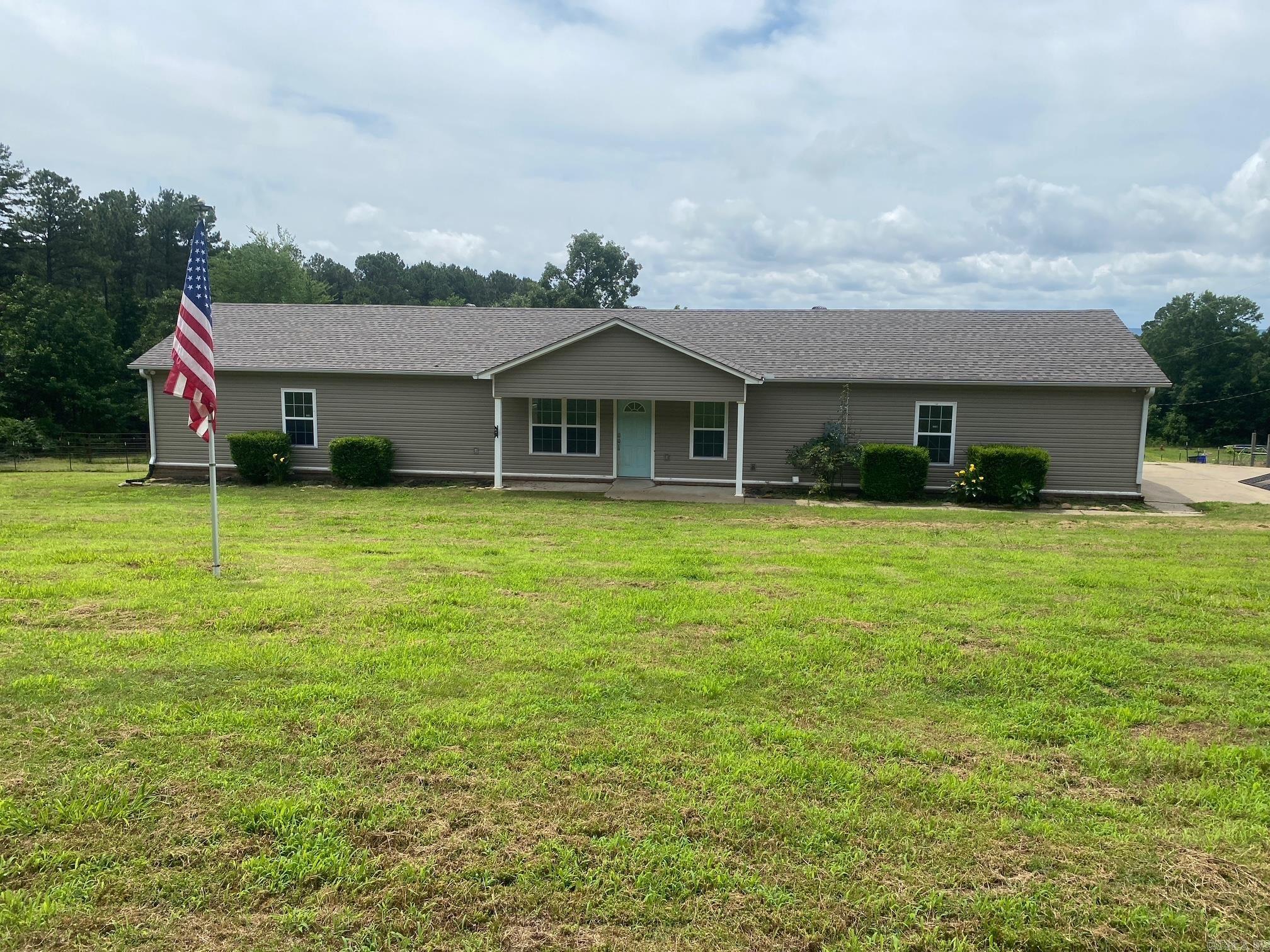 Enjoy the peace and privacy of country living on 1.5 acres just outside the Vilonia city limits. This beautifully designed 1,524 sq. ft. home offers 3 spacious bedrooms and 3.5 baths, with each bedroom featuring its own private ensuite bath for exceptional comfort and convenience.  Inside, you’ll find an inviting open-concept layout with a split-bedroom floor plan, ideal for both everyday living and entertaining. The kitchen showcases stylish concrete countertops and flows seamlessly into the main living spaces. A built-in safe room located in one of the primary bedroom closets provides added peace of mind.  Step outside and enjoy the large deck overlooking the property — perfect for relaxing evenings, grilling, or hosting family and friends. The partially fenced acreage offers room to roam, with space for a horse or other outdoor hobbies.  Need extra storage or workspace? The 18x30 shop with electricity is ready for projects, equipment, or recreational use. Major updates include a BRAND NEW ROOF installed in January 2026 and septic system pumped in March 2026.  If you’ve been looking for quiet country charm with modern functionality, this property is one you won’t want to miss!