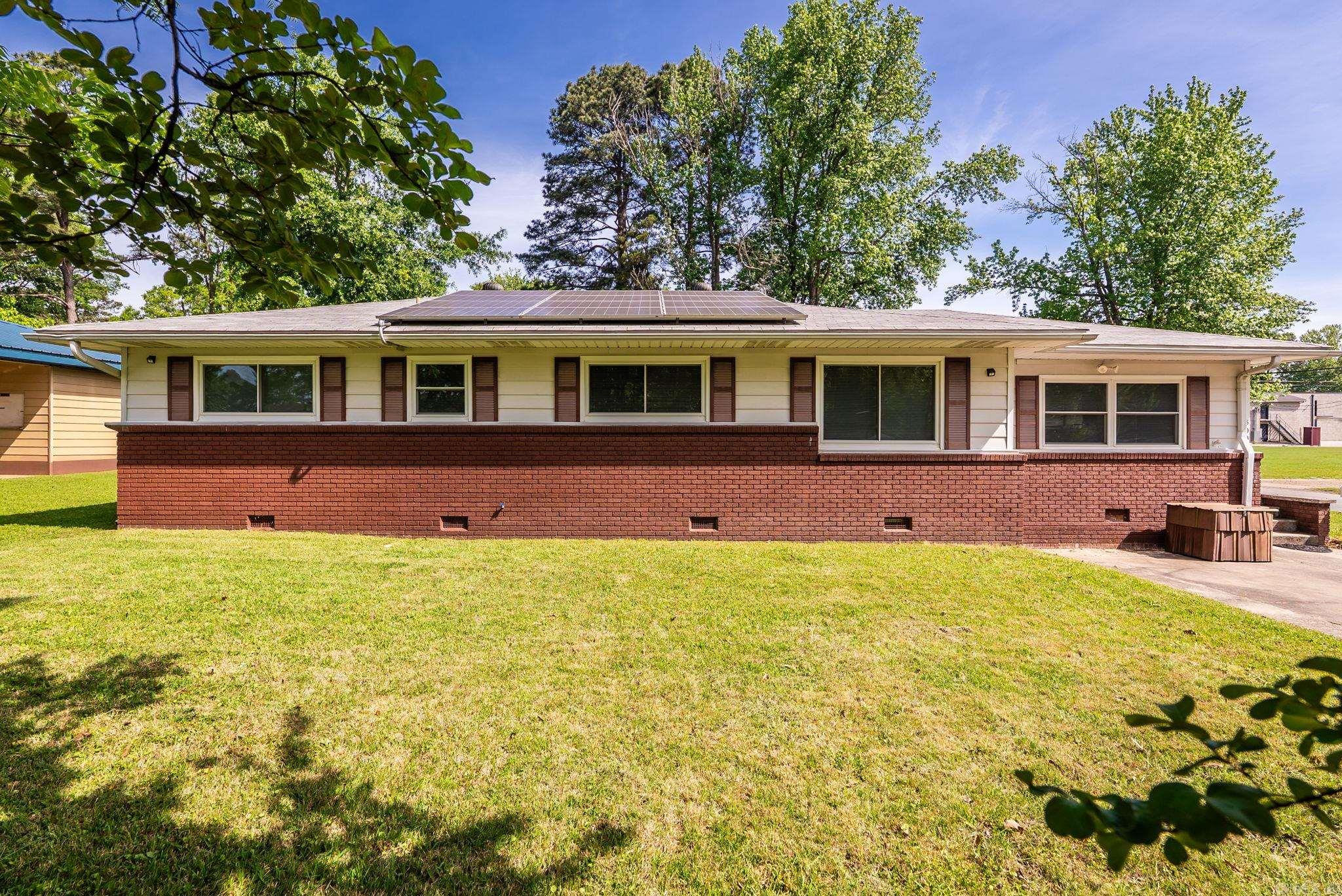 Charming & Energy-Efficient Home in Jacksonville!  This home is all-electric and comes with fully paid-off solar panels, keeping the average electric bill at an incredible $13 per month! Don’t miss this rare opportunity to own an energy-efficient home with amazing outdoor space.   3-bedroom, 2-bathroom home featuring a spacious floor-plan with stylish luxury vinyl plank flooring. This home has been upgraded with newer energy-efficient windows and a newer roof, and fresh interior paint adding to its long-term value and comfort.    Enjoy outdoor living at its finest with a large backyard, wood privacy fence, fire pit, and two storage sheds—plus a full storm shelter for peace of mind.  Schedule your showing today!  *Some photos have been virtually staged*