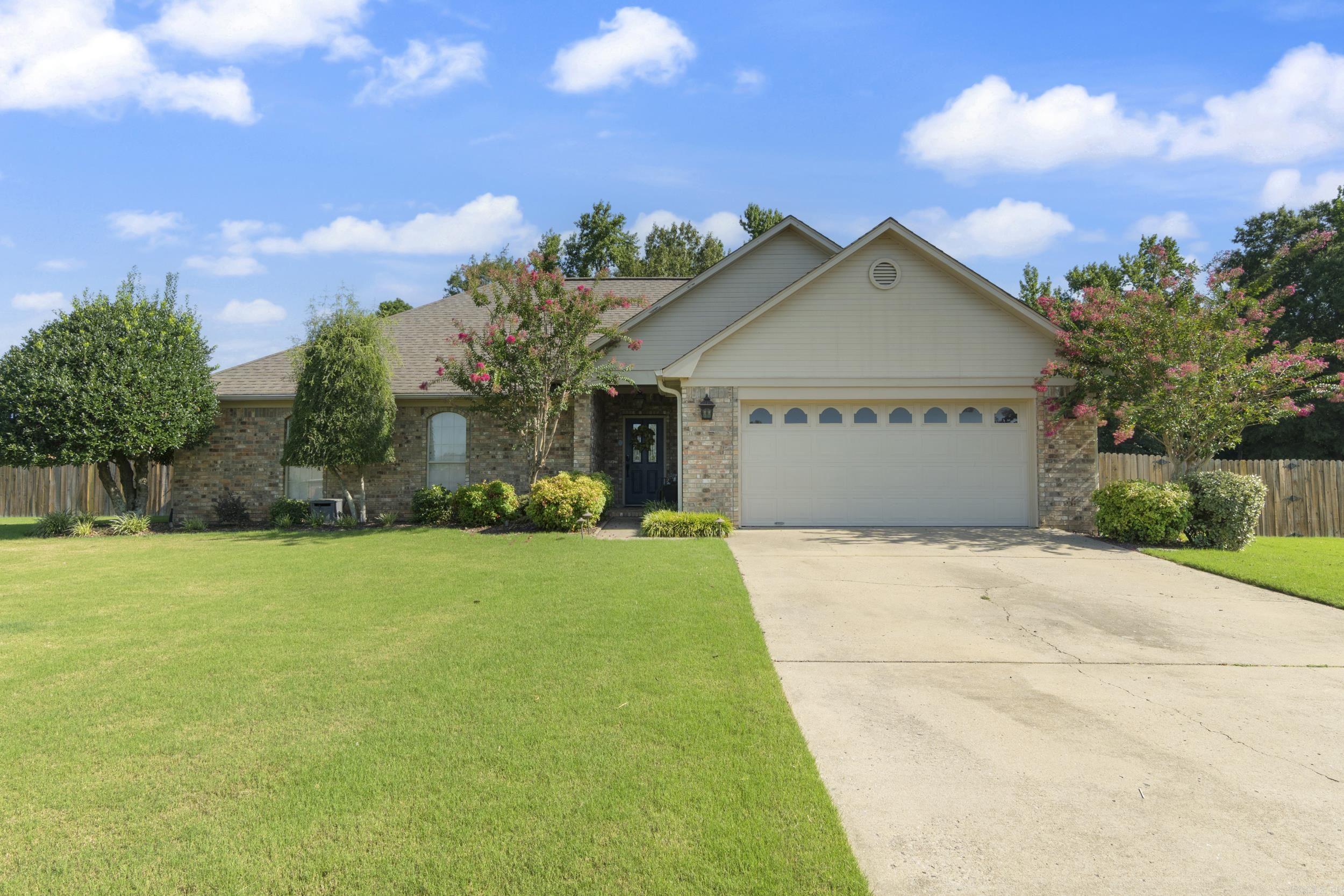 Warm and inviting from the moment you walk in, this beautifully maintained home in Vilonia offers spacious living areas, an abundance of natural light, and a layout designed for both comfort and functionality. The living room flows easily into the dining area and kitchen, creating the perfect space for gathering with family or friends. All three bedrooms are generously sized and thoughtfully positioned away from the main living areas for added privacy. Outside, you’ll find a large covered patio overlooking a spacious backyard with plenty of room to relax, entertain, or enjoy the outdoors. Conveniently located with easy access to schools, shopping and restaurants in Conway, and a quick and easy drive to the back entrance of Little Rock Air Force Base, this home combines space and everyday comfort in one inviting package. See Agent Remarks.