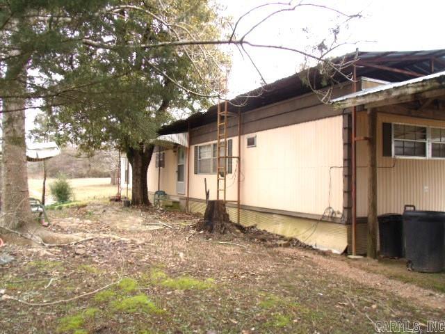 2BR/2BA Mobile Home with 32x50 Shop with new electrical installed on 2.75 Acres.  This property also has a storm shelter.  Older Home on site needs to be torn down. Home is located in the city limits and close to schools and downtown area.