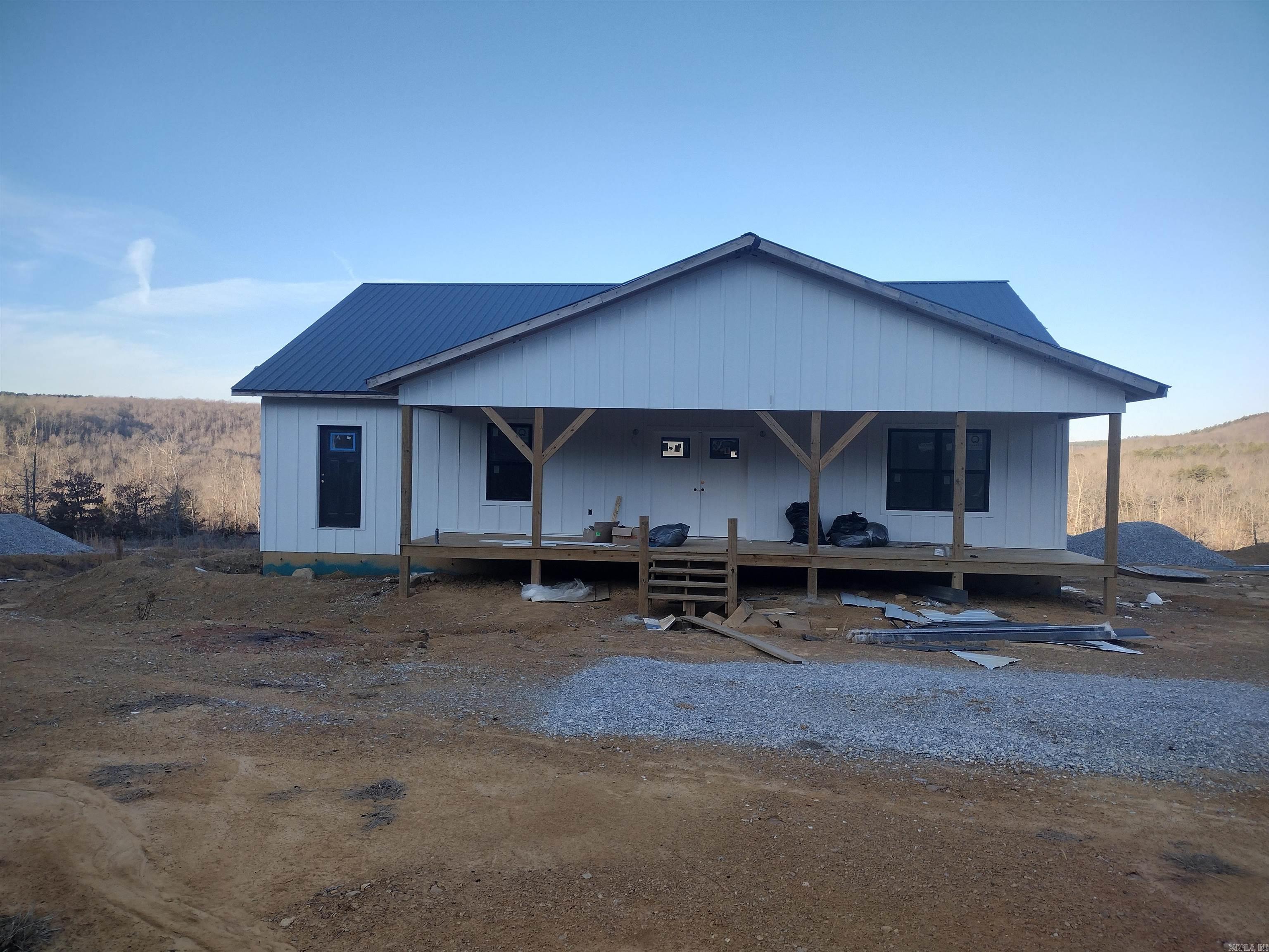 Looking for views with privacy check out this home New unfinished home this home is wired plumbed has sheet rock installed and come with almost all material to finish comes with new Frigidaire appliances. Double gas range, drawer microwave full size refrigerator and separate full freezer on side, dishwasher, tankless water heater and Cali flooring 50-year warranty. This is a must-see property with lots of potential they are still currently working on this home.