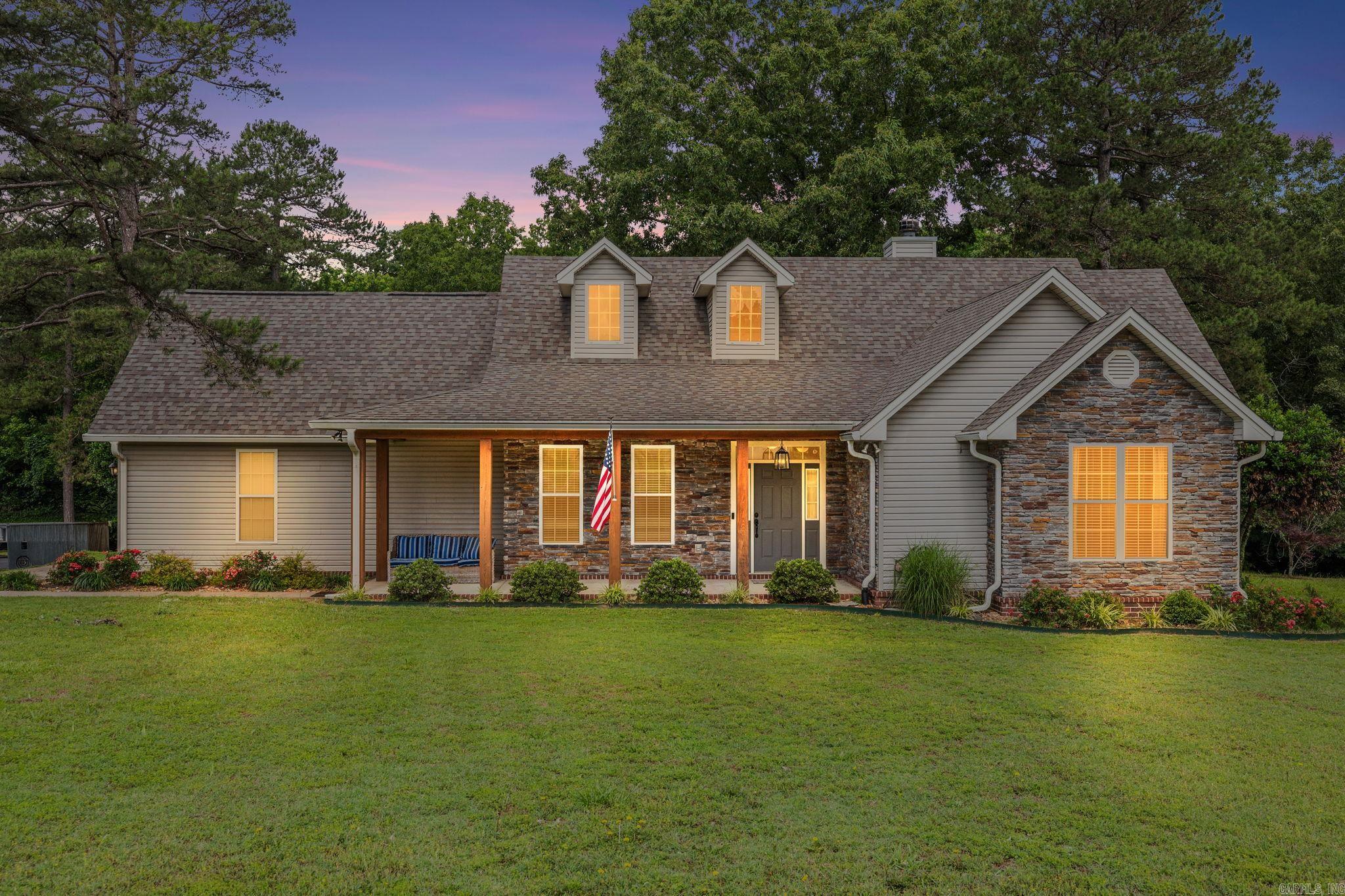 Situated on 1.25 acres in a quiet setting, this well-maintained home offers space, functionality, and modern updates throughout. Featuring 3 bedrooms, 2 bathrooms, plus a heated and cooled upstairs bonus room that functions as a true 4th bedroom, the home offers approximately 2,550 sq. ft. of living space. County records reflect 2,091 sq. ft., with an additional approx. 460 sq. ft. finished bonus room not included in courthouse records.  The property includes a 2-car garage with an in-floor storm shelter, long driveway with ample parking, and a newly built wood deck perfect for enjoying the outdoor setting.  All appliances convey, including refrigerator, washer, dryer, microwave, range, dishwasher, and an additional garage refrigerator.  Major updates include a new roof (2023), new HVAC (2022), new dishwasher (2026), washing machine (2024), and updated kitchen appliances around 2022. Brand-new water heater to be installed prior to closing.  Whole-home generator conveys. Seller’s VA loan may be assumable for qualified buyers, including non-veterans, subject to lender and VA approval, with an approximate 3.125% interest rate.