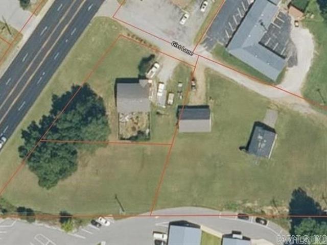 This property is currently zoned residential, with strong potential for commercial rezoning due to its prime location along Highway 49 South and being surrounded by commercial properties on three sides. The seller understands and agrees to be responsible for rezoning the property.  The seller currently occupies the home, so all showings must be scheduled in advance to view both the house and the detached garage. The home is solid and may be a candidate for relocation rather than demolition, offering additional flexibility for future development.  The seller will provide a complete legal description prior to closing. Current legal descriptions are available online and accessible to all agents. The property includes only two structures: the main house and the detached garage. A former outbuilding at the rear of the property has already been removed.  To better understand the layout and potential of the land, buyers are encouraged to view the property on ONX Hunt or Google Earth. The possibilities for this site are truly endless.  If you feel the price does not reflect the opportunity, take a look and share your vision for the property. The seller is open to all reasonable offers.