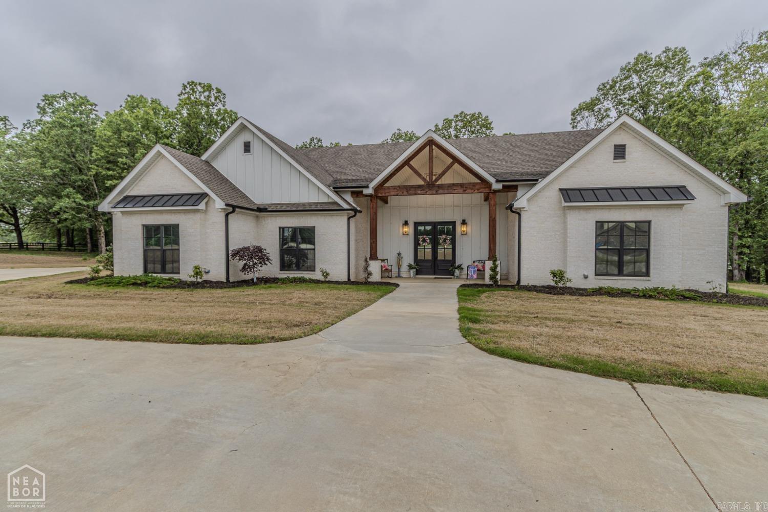 Welcome to your dream home in the sought-after Lakes at Pineknot! This 4,900 sq ft home blends timeless design with modern luxury on a private 4.09-acre lot. It features 4 bedrooms (plus optional 5th bonus room), 3.5 baths, and a flexible floor plan perfect for daily living or entertaining. The show-stopping kitchen includes double islands, high-end appliances, and a hidden walk-in pantry. The spacious living area opens to a covered patio with built-in electric heaters for year-round comfort. The large bonus room can serve as a 5th bedroom, theater, playroom, or guest suite, and a dedicated office adds convenience. The luxurious primary suite offers a soaking tub, dual vanities, and an oversized walk-in closet with a center island. Additional highlights: oversized 3-car garage, safe room, ample storage, large laundry, and private lake access. Don’t miss this one—call today to schedule your showing!