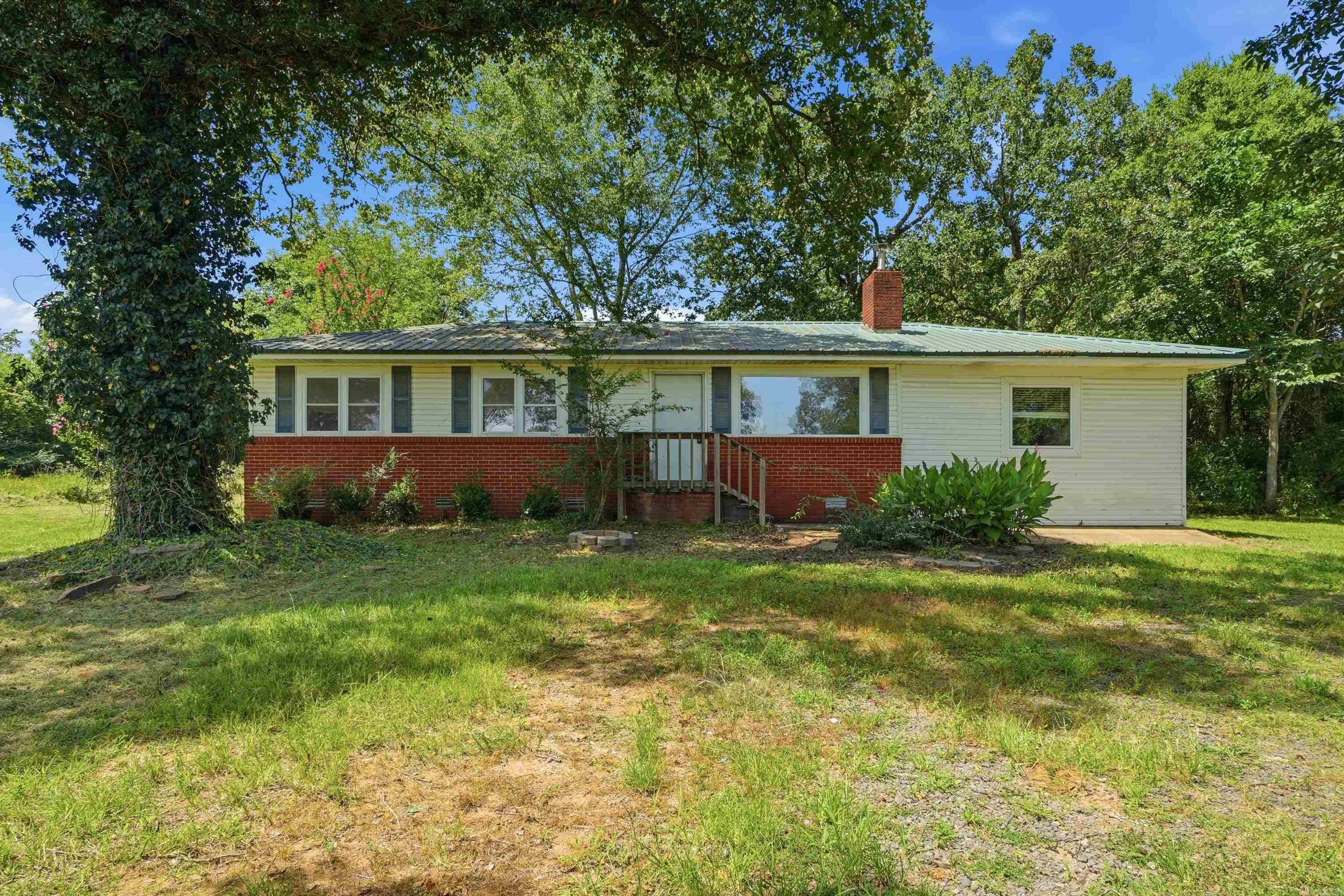 Welcome to 371 Blair Road in Greenbrier, Arkansas! Nestled on over 3 beautiful acres, this 4-bedroom, 2-bath home offers privacy, space, and endless potential. Set back off the road, you’ll enjoy a peaceful country setting while still being just minutes from town. Inside, you’ll find original hardwood floors throughout most of the home, a cozy wood-burning fireplace, and several updates that have already been completed, giving you a great head start on making this property your own. The home is served by well water and is perfect for buyers looking for acreage, character, and an opportunity to build equity. Please note: This property is in foreclosure and is being sold AS IS. Whether you’re an investor, flipper, or buyer looking for a project with acreage, don’t miss the chance to see everything this property has to offer!
