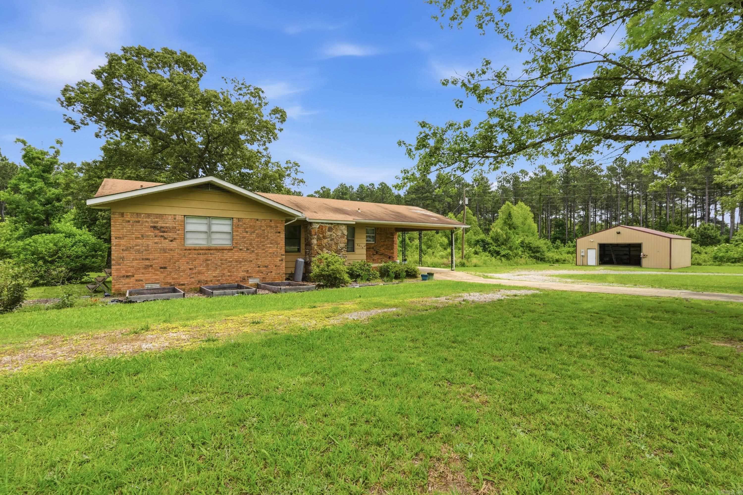 Priced right to Sell quickly. Brick Home with 30x30 shop sitting on 3.33 acres +/- (See survey attached). Lots of potential here with 3 bedrooms , 1.5 baths . Seller has made some of the following updates:  New HVAC & Furnace replaced around 2017 (Electric Heat Pump with gas backup) scraped popcorn ceilings in kitchen, 2019 installed tiled floor & new cabinets in kitchen, painted cabinets, took out paneling in kitchen & installed drywall, new refrigerator 2019, new stove 2025, dishwasher in 2017, & Bought Propane Tank  that will convey as well as small propane tank that stays for space heater  (non working fireplace) Active contract with Hopper Termite. There are still a number of items that need TLC & this is an older roof (See Disclosure online under docs).