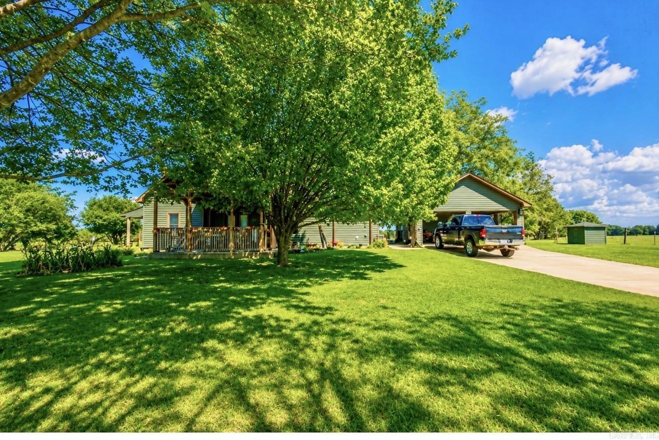 Established poultry farm situated on approximately 23.34 acres with improvements designed to support ongoing agricultural operations. The property includes 2 poultry houses updated in 2024, 2 mobile homes, and a remodeled main residence containing approximately 1,734 +/- square feet. Additional improvements include a hay barn, pole barn, well house, pond, and fenced/cross-fenced areas. The property offers a functional layout with infrastructure already in place for agricultural use and has a long history of poultry production. Conveniently located near the University of Arkansas Southwest Research and Extension Center, this property provides an opportunity for continued agricultural use with multiple improvements situated on approximately 23.34 acres. Square footage information reflects the main residence only. Agents see remarks.