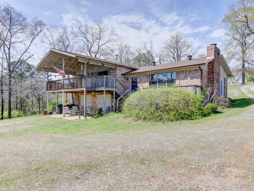 This Charming Ranch is Situated on 1.82 Acres just off of Sunshine Road! Offering 3BR/2BA. Stone Fireplace. Spacious Bedrooms. There is Plenty of Room to let the Kids & Dogs Run and Play! You can Fish and Swim off the Bank, or Launch your Boat and get out on the Lake for the Day!! Enjoy the Great Views from the Back Porch ~ I would literally sit here EVERY afternoon!! Perfect Garden Spot. Call Today for a Showing!