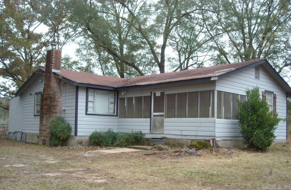 GIVE US A CALL FOR A SHOWING OF THIS COUNTRY HOME LOCATED JUST OUT OF TOWN IN STRONG ARKANSAS  - All offers must be submitted via Propoffers.com