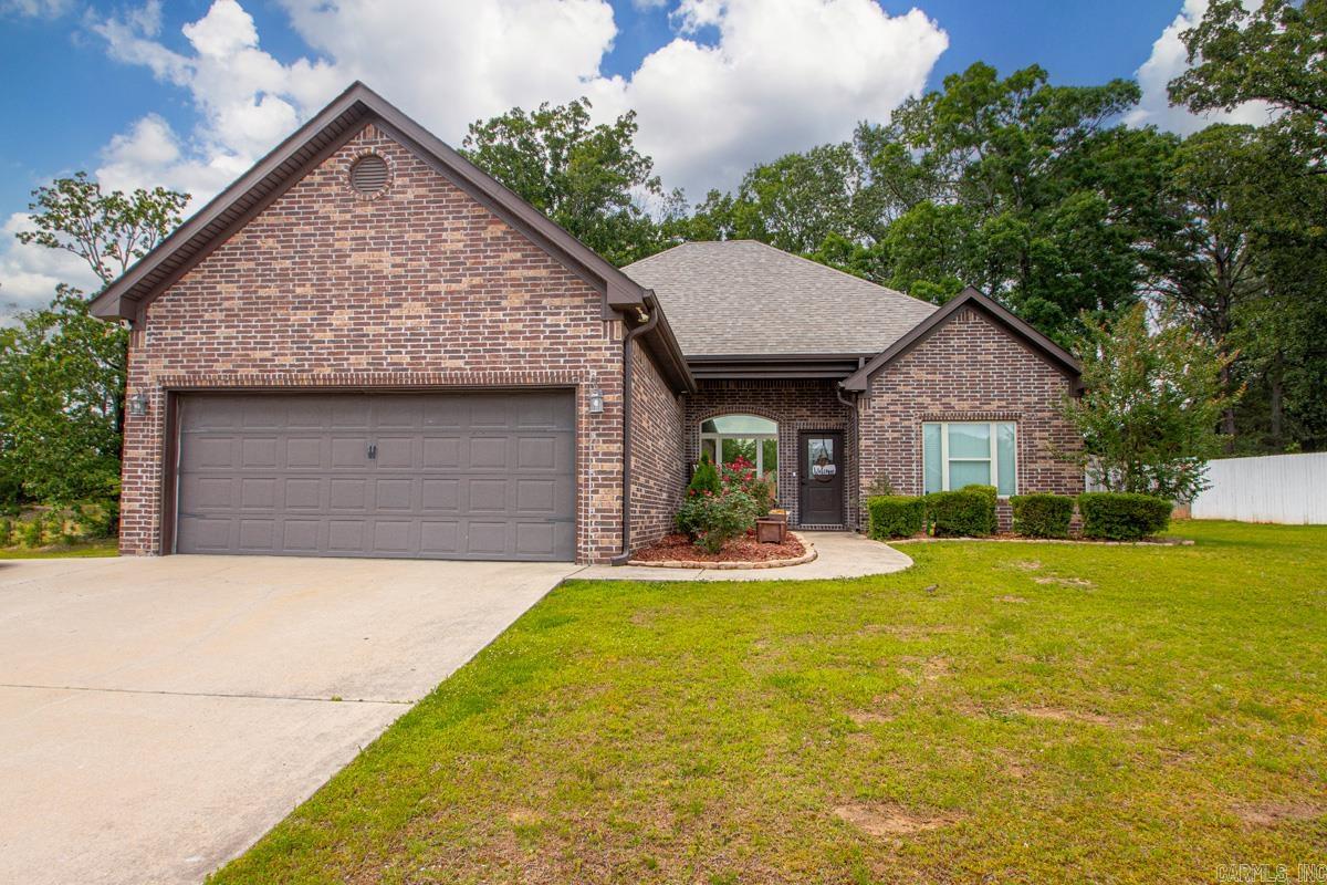 Welcome to this gorgeous home located in Crossroads Village! Only minutes to Hwy 70 & I-30 and convenient to Benton, Hot Springs & Little Rock! From the moment you enter, the 13 foot ceilings draw you in, offering open-concept living and a special cozy atmosphere! The living room is large and open to the dining and kitchen! The kitchen features stainless steel appliances and granite countertops! The master is separate from the 2 additional bedrooms and features a beautiful trey ceiling and large windows, flooding the room with natural light! The master bath with double vanity and separate tub and shower flows directly into the roomy master closet! The guest bedrooms are opposite side of the home and are both large with great closet space! The large, covered back porch is the perfect spot for grilling and entertaining! The fenced in back yard is huge and offers the ability to expand into the almost 1 acre lot! NEW HVAC April 2026. NEW ROOF 2024! Don't miss your opportunity to own this amazing home in a fantastic location! Schedule your private tour today!