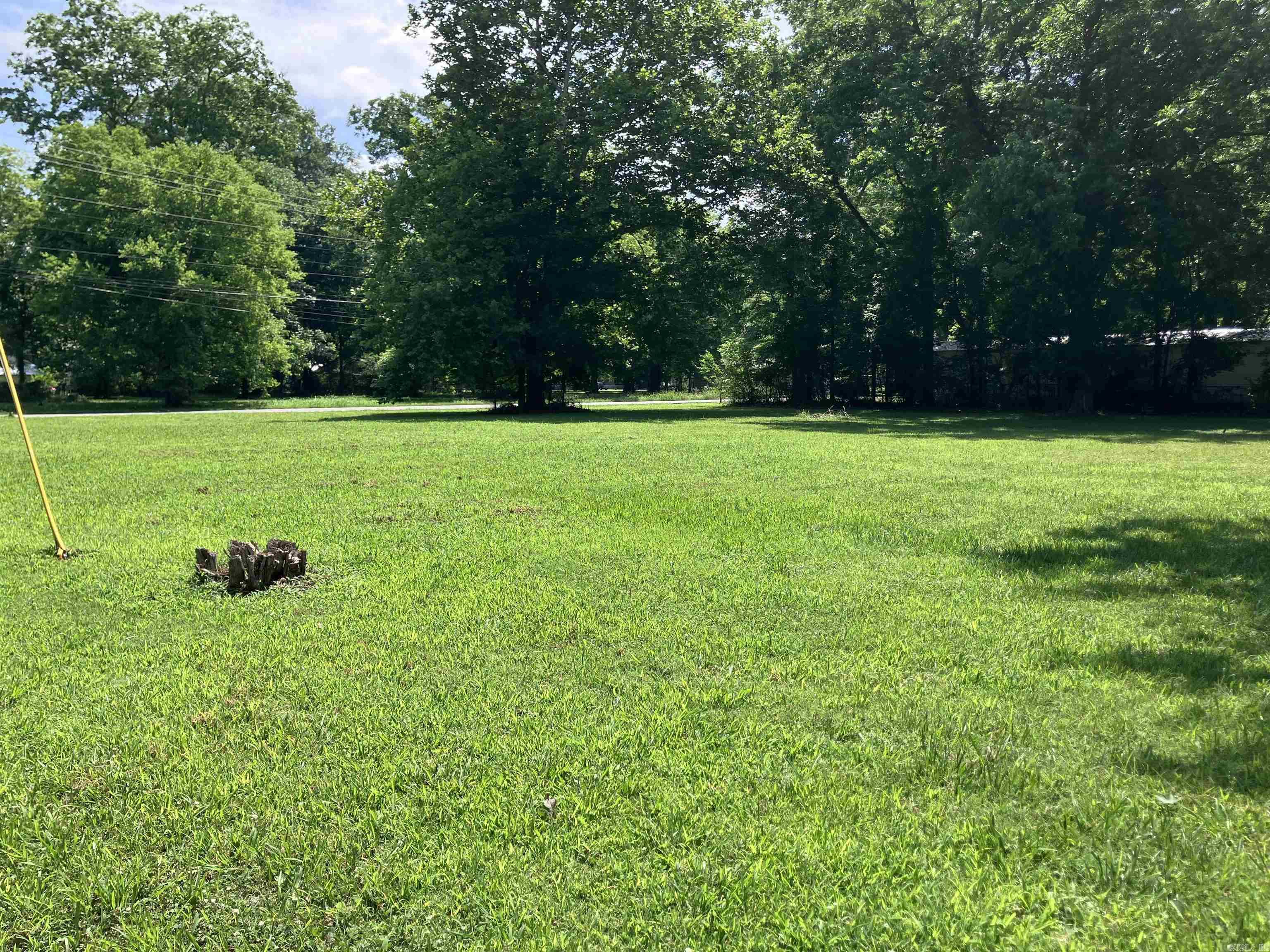 Nice, level corner lot that would be great for building a home. A mobile home could possibly be moved onto it with the permission of the city. There was a house on it at one time, so utilities should be in place. Call today!