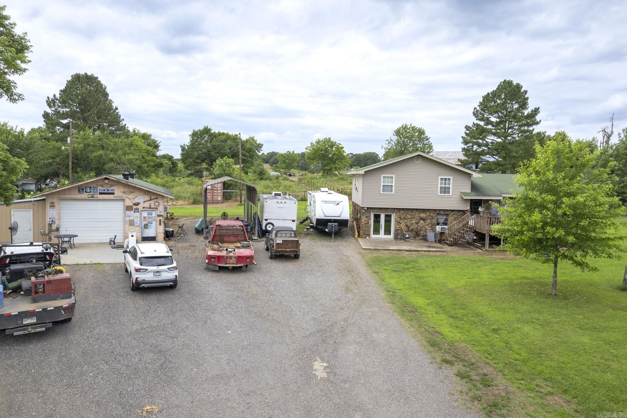300(+-) acres with a working cattle and horse ranch.  House sits on a parcel that is in the city of Plainview and the majority of land is in the county.  Therefore, they are taxed differently.   The ranch includes 4 ponds and a running stream.  Owner is downsizing the two houses are included in the sale. See photos for outbuildings which includes a GRAIN MILL setup that operated for 22 years. (Roof was partially damaged during the last ice storm).  Expand your current ranch or consider this ranch a possible addition.   Dream of owning a ranch with grazing land and a hay pasture?  Then this is for you or someone you know!  AGENTS SEE REMARKS.