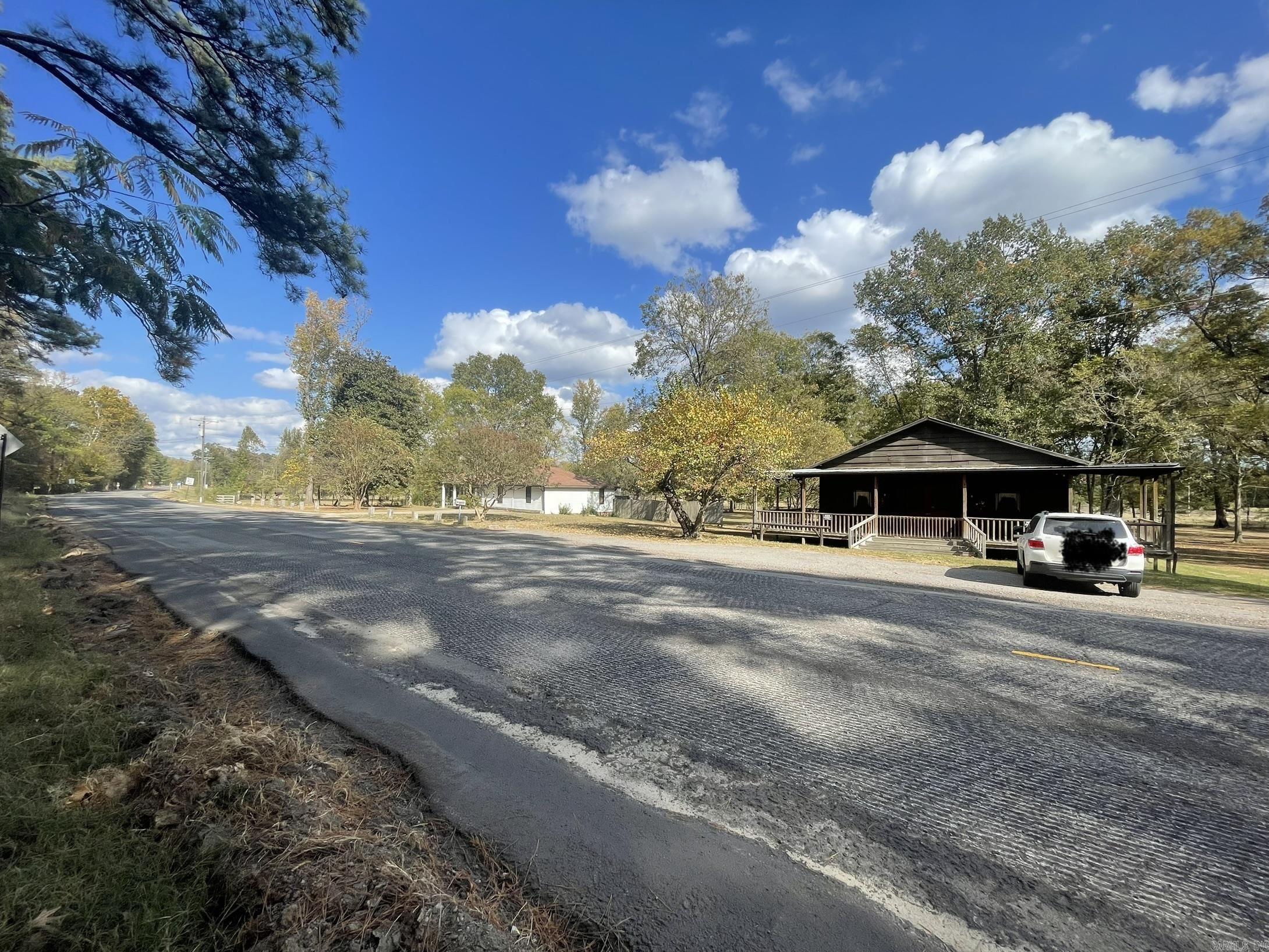 This property is in the heart of what is happening and right next door to the future Benton Buc-ee's! *** Located off of Exit 114 in Benton on Highway 229 close to the Saline River.  This property is surrounded by the proposed Benton Thomas Park, Park, RV Park and Sports Complex, and other potentially large commerce coming to Benton! (Option in place but not closed.) This would be a great site for a lodge, hotel, or other commerce. This property is a short distance from the Saline River, but the river is not currently visible at the home's elevation.   There is a home and a beautiful old antique store on this property.  The property is not in the city limits but is surrounded by the city of Benton annexation.  Home is occupied, so please set up an appointment before looking at the land.