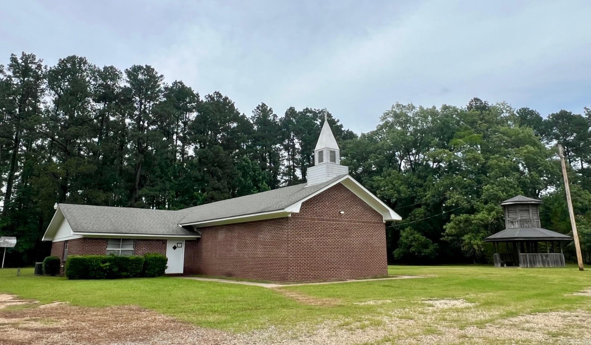 Seller does not limit the uses of the property.  Buyer will need to check with county planning and zoning to get approval of uses.  Approximate 3000 SF previous church building with sanctuary, fellowship hall, multiple bathrooms, multiple office and classrooms. Two county parcels totaling 3 acres.  Drew county parcel # 704-00439-000e and # 704-00443-000e.  All showings must be accompanied by a Realtor. NO Disclosures provided by seller. Existing personal property will remain but will not be considered part of the sale.  Any items left in the building will be considered as-is and abandoned and will have zero value.  Seller makes no guarantees, warranties, or representations of any kind regarding the existence, condition, or usability of said personal property which will remain in building at closing. Title transferred by Special Warranty Deed/Trustee Deed.