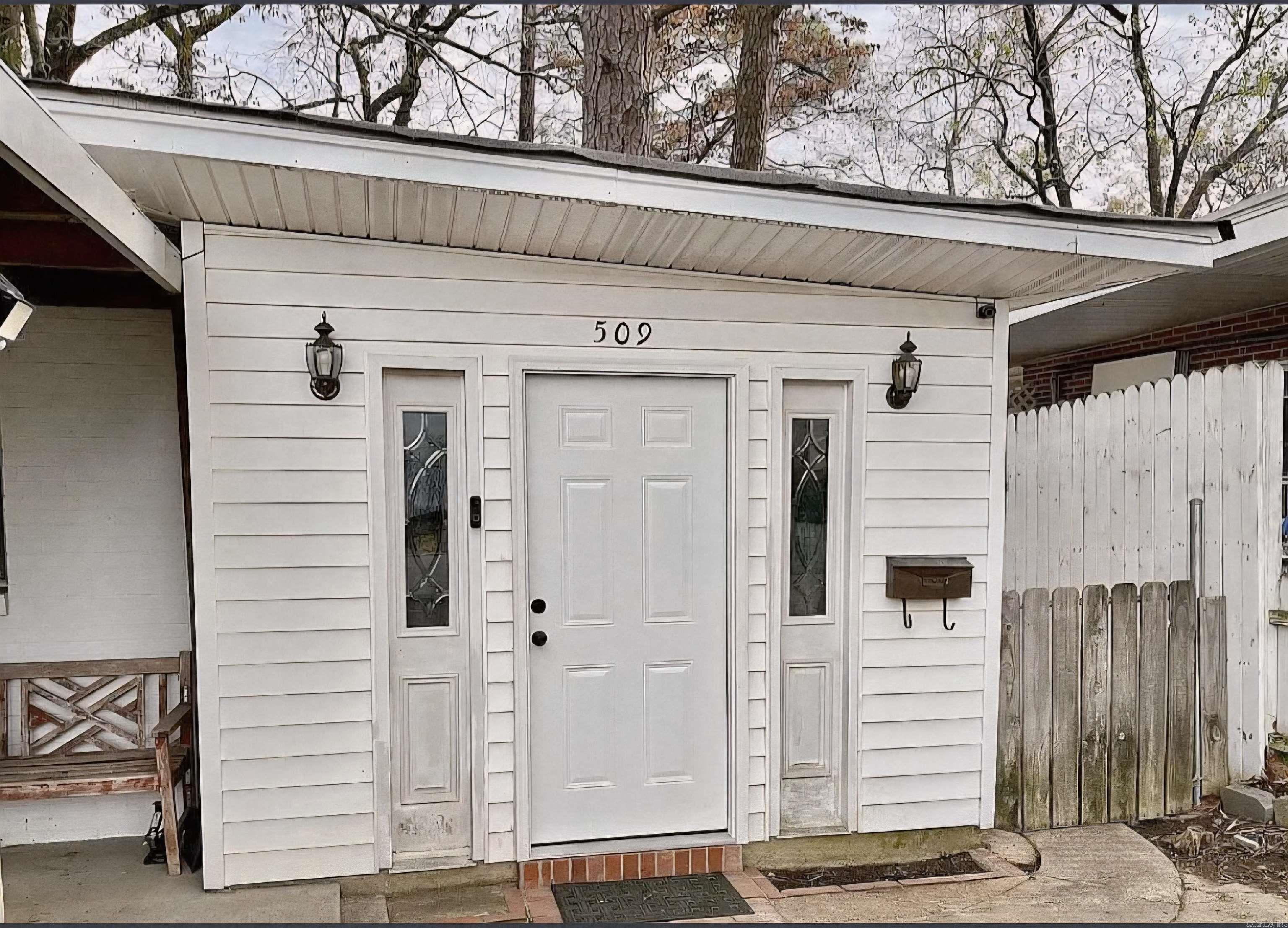 When you step into 509 Cherry Lane, you’ll immediately appreciate the blend of historic charm and modern updates. Original hardwood floors and stunning wood tray ceilings with shiplap accents create a warm, inviting atmosphere. The home offers two spacious bedrooms plus a versatile bonus space that could easily serve as a third bedroom, office, or flex room. A large screened porch off the primary bedroom provides the perfect place to relax, overlooking a low-maintenance backyard.