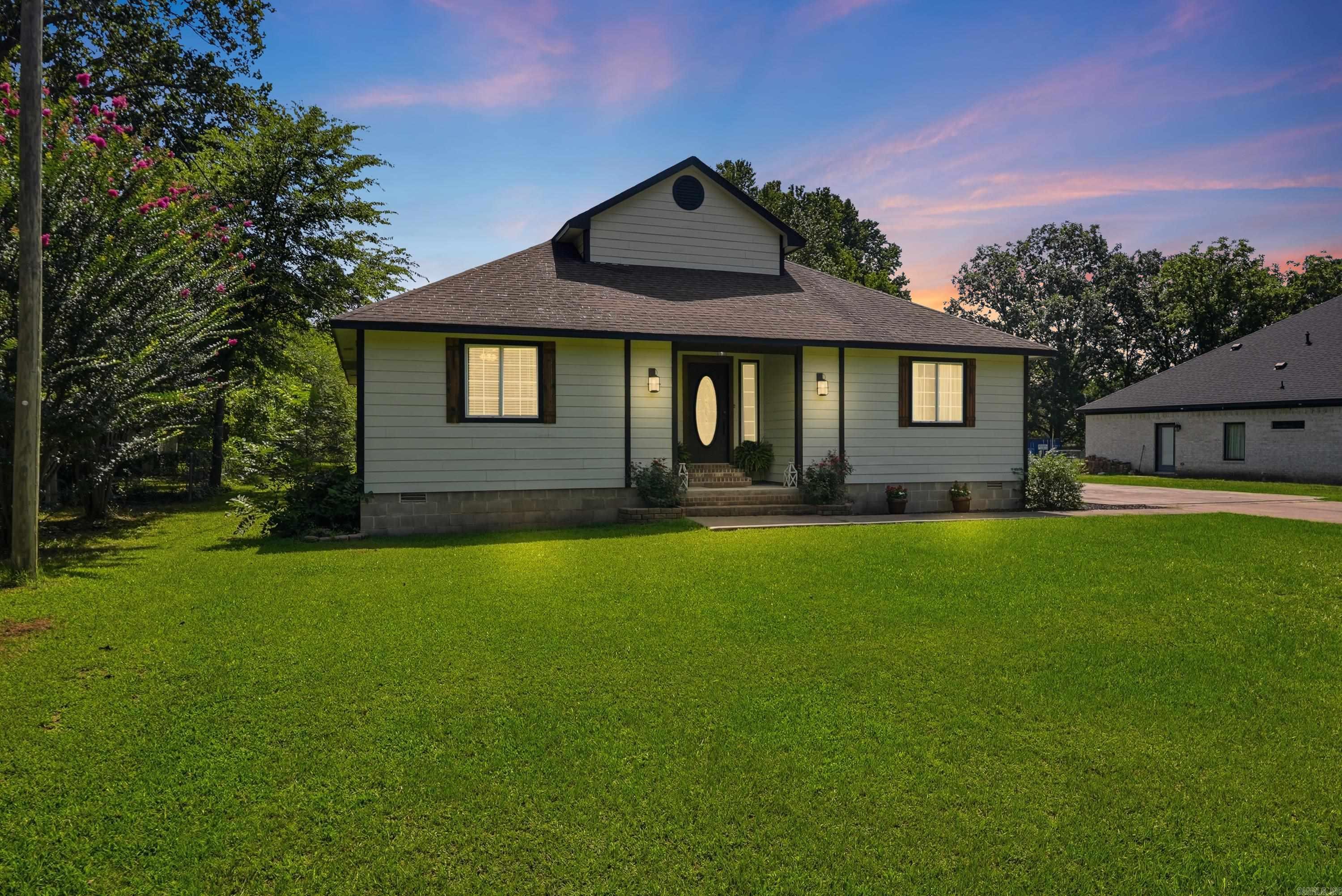 Welcome to your beautifully refreshed 4-bedroom, 2.5-bath home on a full half acre in the heart of Bryant! From the moment you pull up, you'll feel it. This one is different. Step through the front door and let the natural light do the talking. Sunshine pours through big windows in every room, and the stunning living room fireplace sets the tone for cozy nights in and unforgettable gatherings. Modern finishes throughout mean all you have to do is move in and start living. Then head upstairs to the showstopper: a massive bonus room ready to become whatever you dream up. Home theater? Game room? Office? Playroom? Yes, yes, yes, and yes. Outside, your level half-acre lot is a blank canvas. Fire up the grill, plant the garden, let the pets run wild, there's room for it all. And the storage shed stays, so your tools and toys have a home too. All of this just around the corner from Bishop Park, with everything Bryant has to offer minutes away. Homes like this do not wait around. Schedule your showing today and come see it before someone else falls in love first!