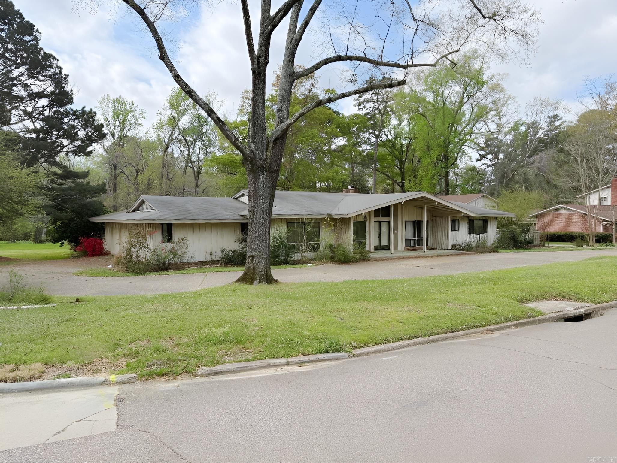 Give us a call for a showing on this huge home located in the Country Club Colony Addition. This home has 2 living areas, large kitchen and dining room overlooking the large den.
