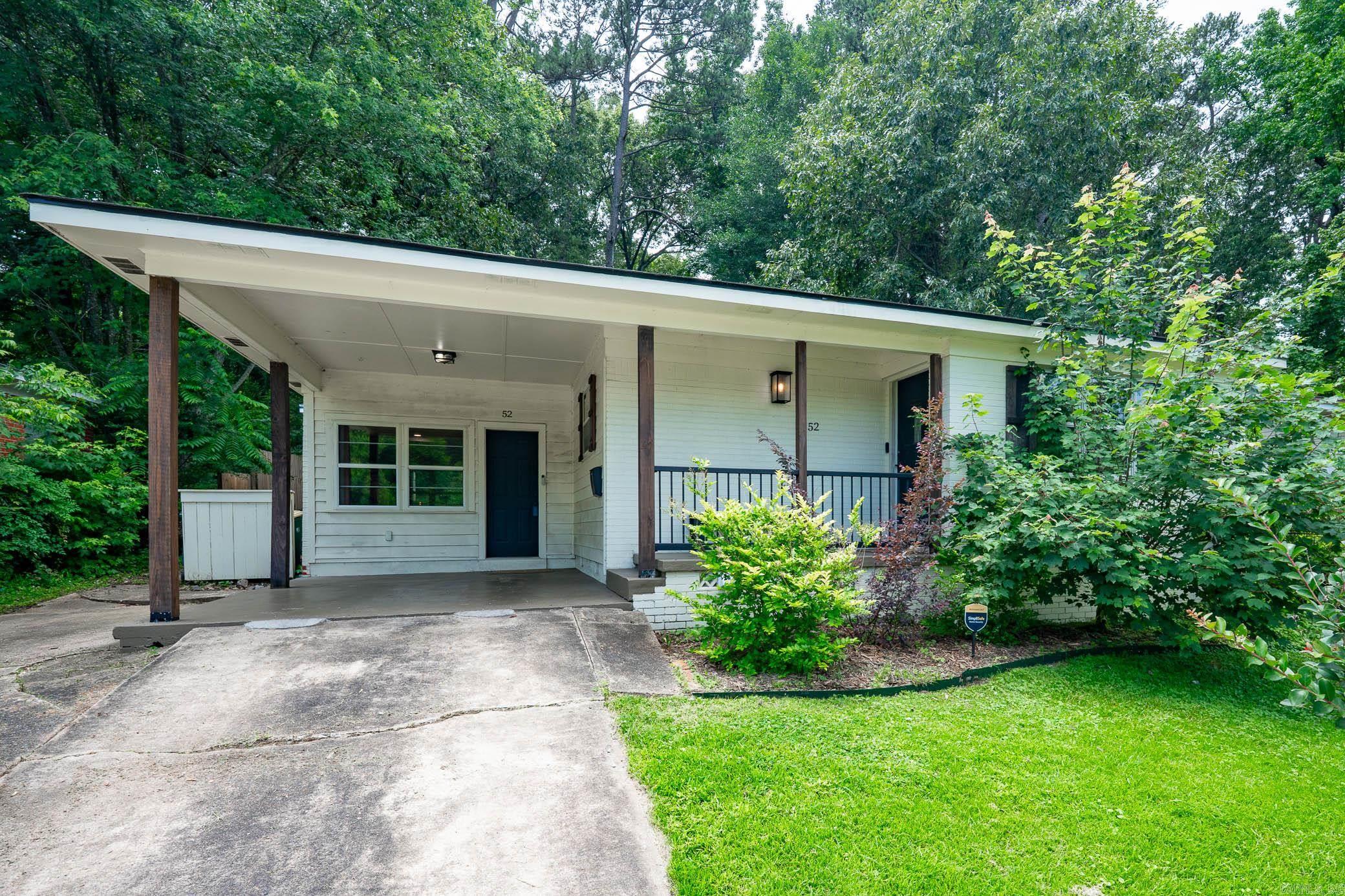 Charming and beautifully renovated, this 3-bedroom, 1.5-bath home blends classic character w/ modern updates in the heart of Midtown Little Rock. Built in 1957 & offering 1,482 square feet of thoughtfully refreshed living space. The interior has been completely remodeled, showcasing updated finishes while preserving its original charm such as the real hard wood floors. As you enter from the carport, the functional layout provides a comfortable living room w/ a wood burning fireplace & lots of natural light. It's in this room you will find the laundry area with both the washer and dryer that will convey. The kitchen is absolutely beautiful w/ solid surface counters, subway tile backsplash, gas stove & stainless steel appliances including a refrigerator that will also convey. Off of the kitchen you will find another living room that can easily be used as a dining room or even a home office. Three spacious bedrooms can be found down one hallway where you'll also find a full bathroom & a half bath connected to one bedroom. Ideally located just minutes from UALR, shopping, dining, and I-630 this move in ready home offers both convenience and style in a midtown neighborhood.