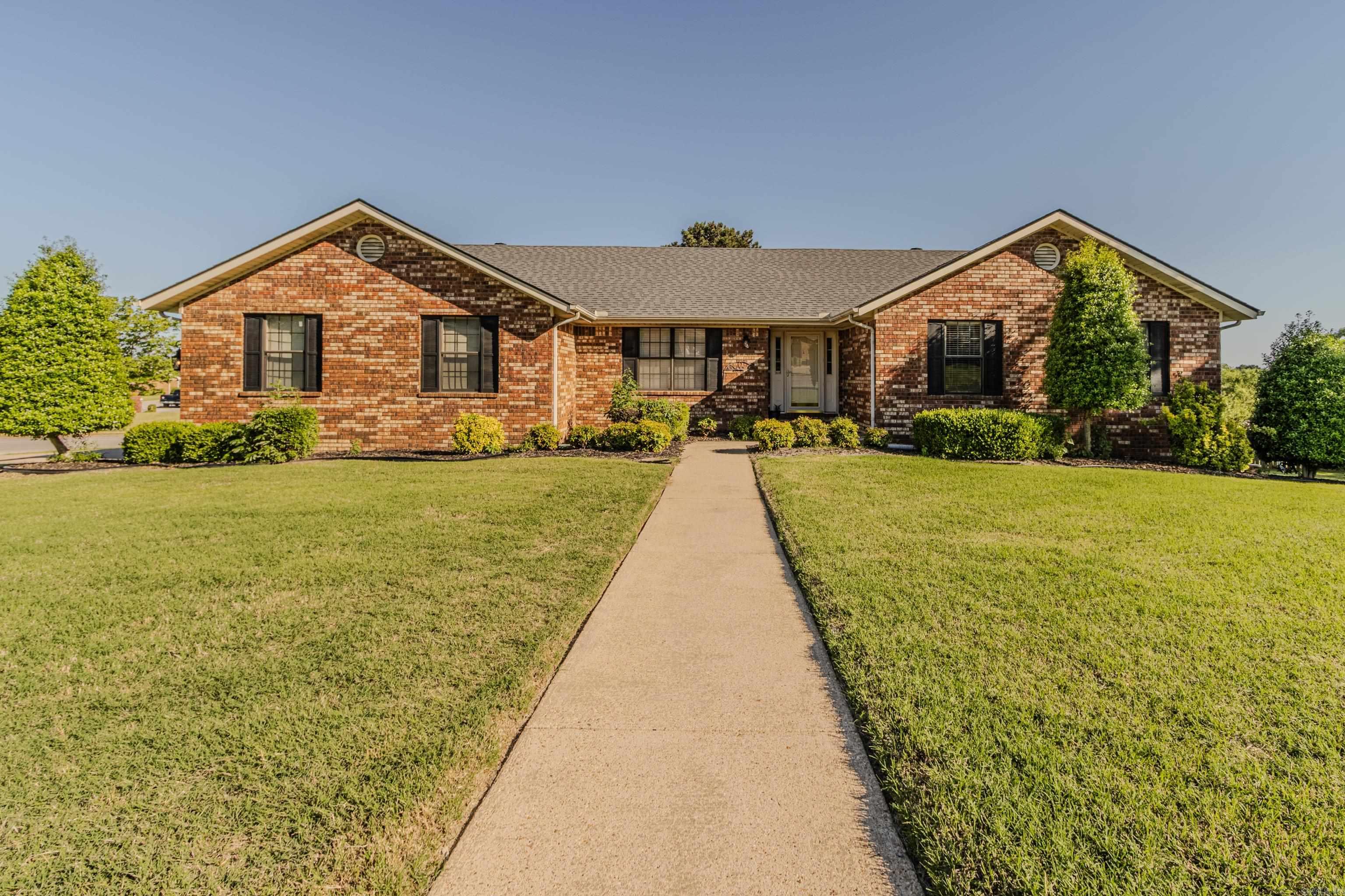 Situated on a spacious corner lot in an established subdivision, this all-brick home offers generous living space, functional design, and endless versatility. The main level features a formal dining room and an inviting open living area complete with a brick fireplace and custom built-ins. The updated kitchen is equipped with double ovens, ample cabinetry, and a convenient dry bar — ideal for entertaining and everyday living. Upstairs, you’ll find 3 bedrooms and 2.5 bathrooms, including a comfortable primary suite. The walk-out basement expands the home’s possibilities with additional living space, a bonus area, abundant storage, and a full bathroom, making it perfect for a media room, guest quarters, home office, or recreation space. A standout feature is the impressive 760-square-foot shop with garage door entry, offering incredible flexibility for hobbies, projects, storage, or workspace needs. Enjoy outdoor living from the deck overlooking the property, all within a well-established neighborhood setting.