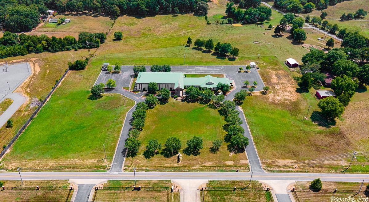 Large church on 10 acres nestled in the middle of Conway. Church is close to the interstate and  to both residential and commercial areas. There are over 150 painted parking spaces with plenty of green space for growth (ten acres). The church has a large sanctuary with a balcony and includes a baptistry and changing room with restroom facility behind the stage. There is also a nice fellowship hall with an appropriately sized kitchen and pantry. Plenty of rooms for classes, offices, and various ministries.