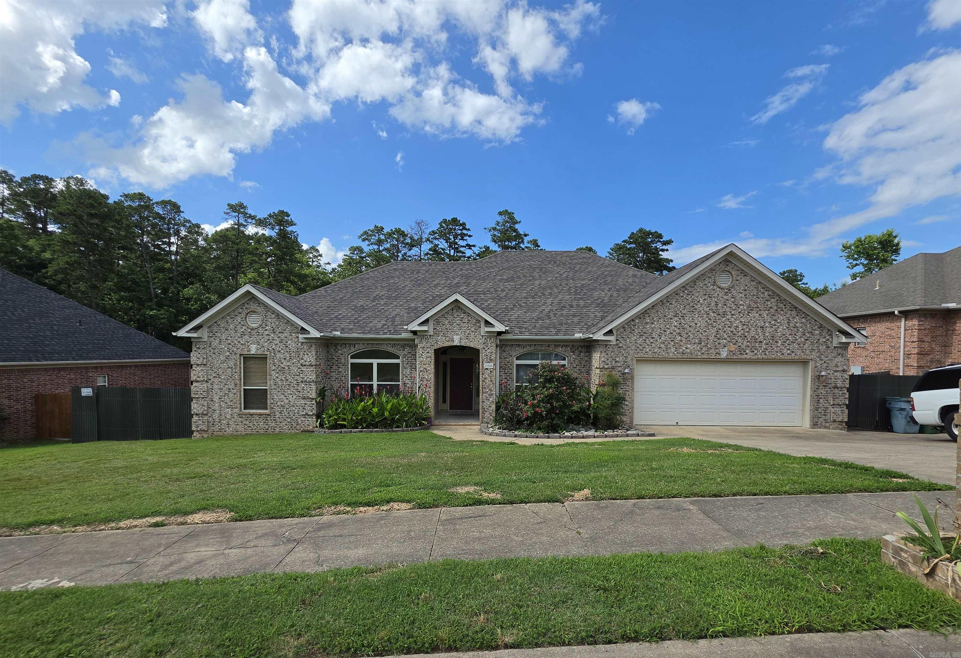 Retreat to this lovely 4 bedroom, 2.5 bath home with a formal dining room, and a nice breakfast room.  Kitchen has a breakfast bar and granite countertops.  Nice sized living room with a beautiful fireplace with gas logs.  Hardwood floors and LVP in the main bedroom.  Crown molding.  10 foot ceilings & tray ceilings in LR & primary bedroom.  Enjoy the natural light coming into this home with an arch window on the front and a big window on the back. Great floor plan with 3 bedrooms on one side of the house.  The backyard retreat currently has a forest view with utility easement behind the property.   There is a 220 outlet in the garage.  Extra parking on the right side.  There was an above-ground pool which has been removed and the dirt was seeded for grass.  Both sides of the house have good yard space with big gates on each side for access.   Come watch the wildlife from your breakfast room.    Roof was replaced in May of 2019.