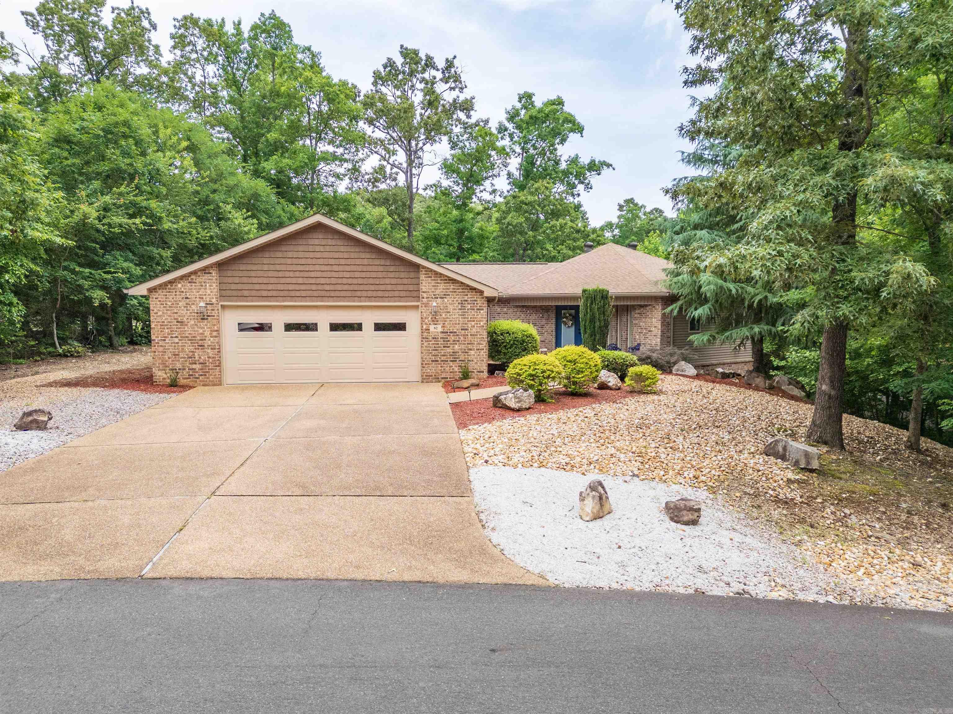 Golf-front living on Magellan’s 17th Fairway & Green! Whether seeking a personal sanctuary, multi-gen estate, or premium income producer, this move-in ready residence delivers absolute comfort in a highly practical footprint. Freshly painted & thoughtfully designed with accessibility in mind, the zero-entry layout boasts wide spaces, vaulted ceilings, wrapped-beam accents, & walls of windows framing panoramic views from every room. The bright kitchen features generous granite counters, dual pantries, & a classic diner-style conversation bar flowing into the living area anchored by a maintenance-free electric fireplace. Retreat to the primary with propane fireplace, & private deck access. Every bedroom comfortably fits a king bed, plus storage is exceptional throughout, including an oversized laundry room with basin. The true hidden gem is the lower-level lock-out suite featuring a living area, bedroom, ensuite, & kitchenette. Step outside to a professionally landscaped oasis with a covered patio down & covered deck up. Complete with an oversized 2-stall garage with workshop/golf cart space, this rare property is hard to beat!
