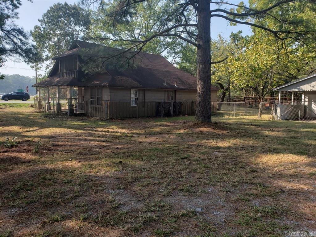 Looking for a place for your new business? Or a great spot to potentially build multiple homes? This spacious spot is ready for development! This listing includes the home on the property (will need renovations) along with 1.29 acres of land. NOT included in this listing are 3 additional tracts of land behind this property - each tract is 3.19 acres - with one tract including a pond. Seller would entertain a package deal for all 4 total tracts. These other 3 tracts are each listed individually. Total potential acreage would be approx. 10-11 acres if all purchased together. High visibility for commercial use with high traffic count. Front could be commercial and the back could be used for housing. So much potential and opportunity for this one! Call us today for more information!