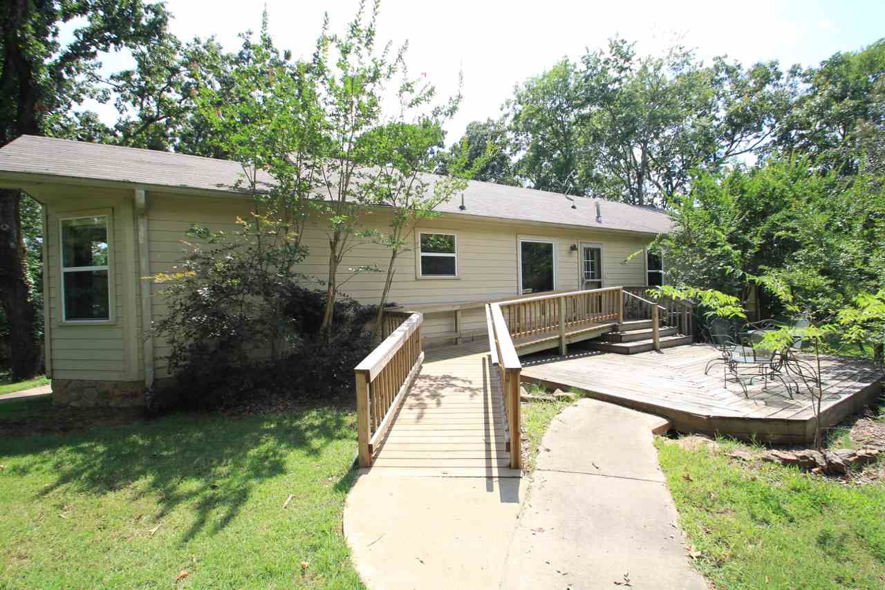 If you yearn for a home in the country w/ plenty of room to roam, take a look at this home on ten acres!  Built in 2000, this 1897 sq ft home has custom-built oak kitchen cabinets, including pantry w/ slide-outs.  There's a breakfast nook & a separate dining room.  French doors in the large living room let in lots of natural light.  Handicap accessible w/ entry ramp, wide doorways & halls.  Home sits at end of long paved drive.  Invisible fencing for your pups.  Roof & HVAC 5 yrs old. [AGENTS SEE REMARKS]