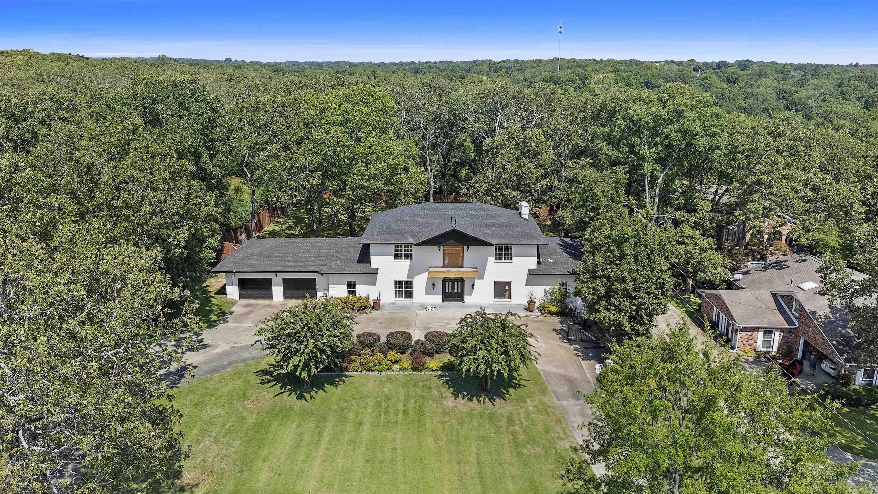 This Wonderful Sherwood Home is a rare find, on Approx. 1.10 acres! The exterior has beautiful updates including a New Roof, and New Exterior Paint, and sits on a level, stunning lot...Green Hills Golf course is right across the street-you can ride your golf cart straight to it! Also has a 3 car garage with a circle drive. The inside is an open book, for you to create your own dream home! RECONSTRUCTION IS NEEDED FOR THE INTERIOR OF HOME!...There is also an ELEVATOR in the house, to access all 3 levels (inspection highly recommended) Wonderful back deck overlooks large, private back yard. Large den, large office, large bonus room....so many options here!! This home is being SOLD AS-IS....no disclosures.