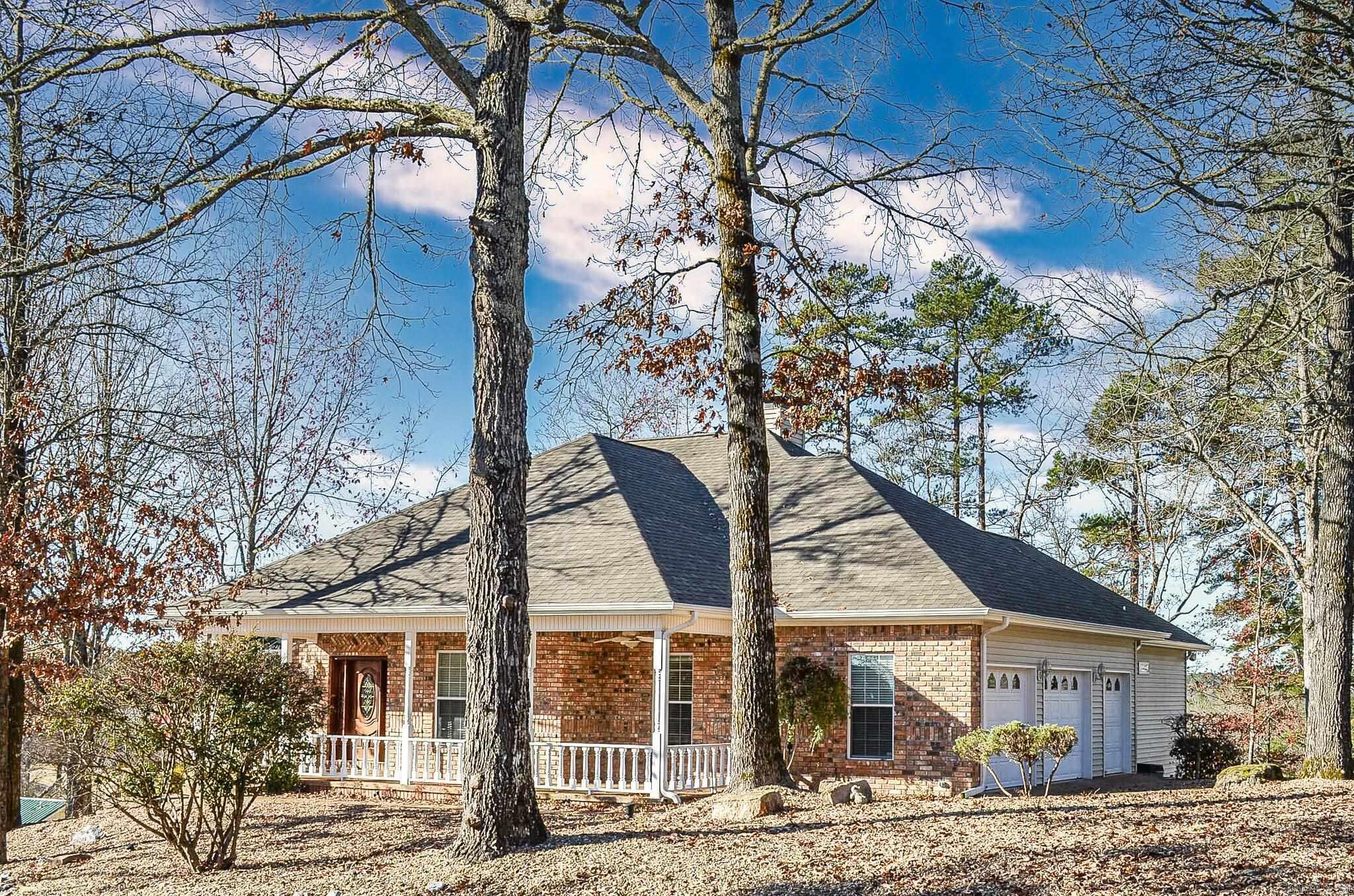 Stunning golf-front home on Magellan Golf Course, custom built by Ben White. Enjoy the beautiful course views from the expansive deck and almost every room in the house! Vaulted living room with gas-log fireplace. Updated flooring. Kitchen features granite countertops, wall oven, surface cooktop, pantry with pull-out drawers, and both eat-in kitchen and formal dining areas. Spacious primary suite offers a sitting area with french doors to access the deck, large walk-in closet, updated bath with soaking tub, dual vanities, and tiled shower. The lower level includes a kitchenette, den, bedroom, full bath, and private porch - all the perfect area for guests or entertaining. Front porch provides a relaxing spot for rocking chairs to enjoy the view from the front. Over-sized garage and a golf cart garage completes this exceptional home. AGENTS SEE REMARKS